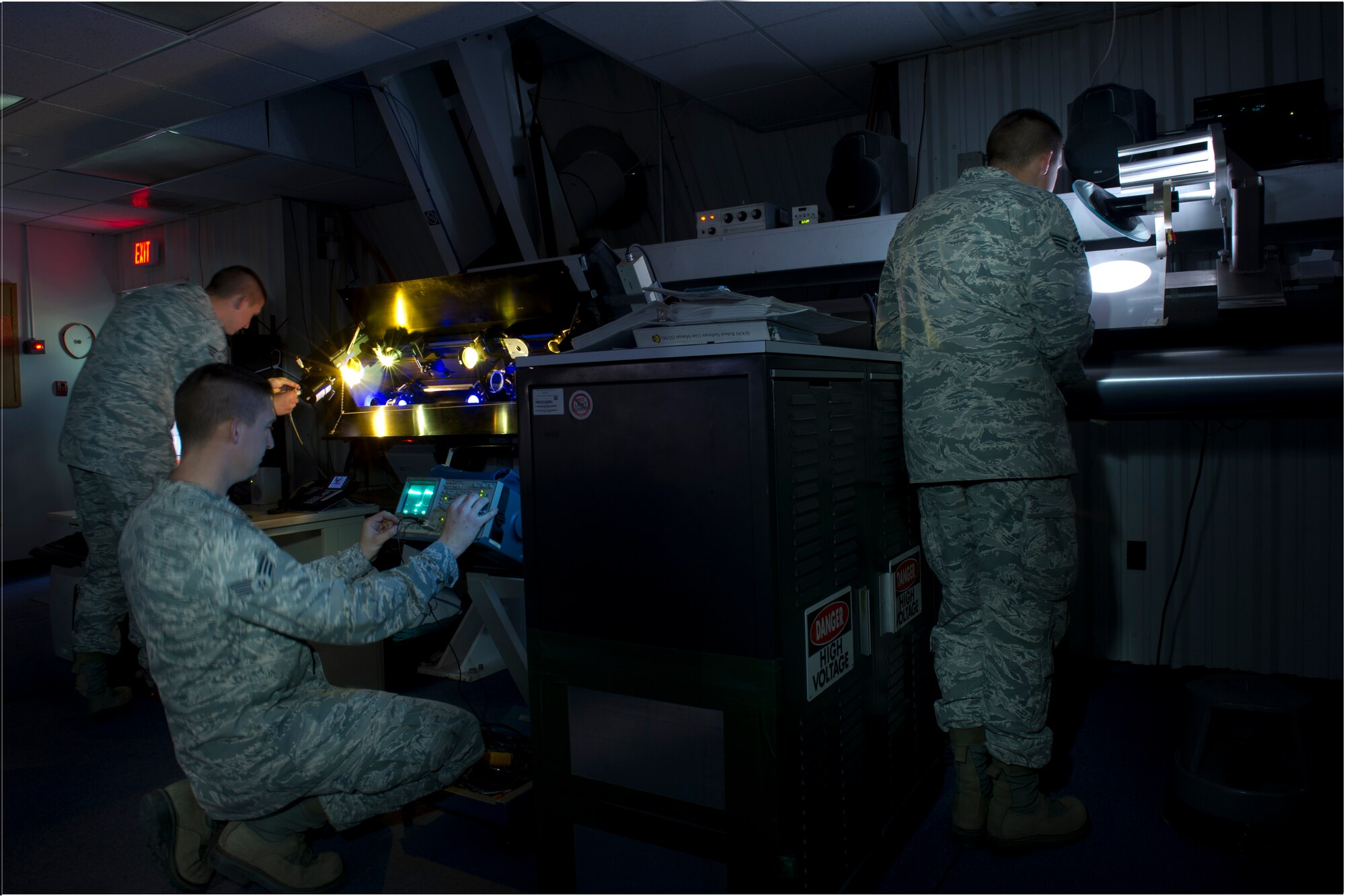 Senior Airman Dustin Raab, 49th Communications Squadron solar systems technician, performs preventative maintenance on the AN-FMQ7 Solar Observing Optical Network at Holloman Air Force Base, N.M., March 7. When he is not maintaining of the SOONs, Raab loves to spend time with his wife, who works in the 49th Maintenance Squadron as a F-22 armament systems technician. He also enjoys working on his 2000 Chevrolet Camaro SS. (U.S. Air Force photo illustration by Airman 1st Class Michael Shoemaker/Released) 