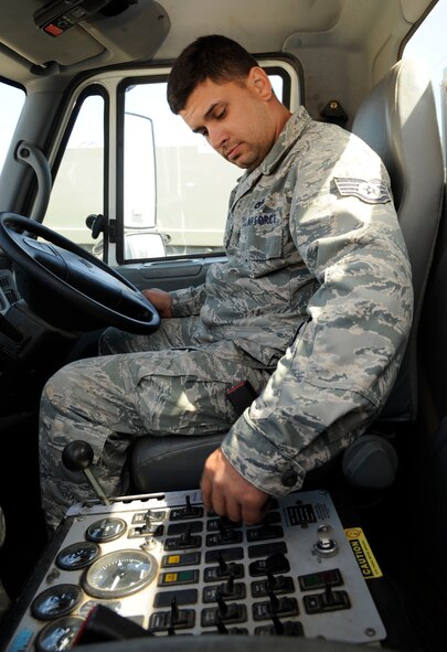 Staff Sgt. Kyle Pullum, 2nd Civil Engineer Squadron Heavy Repair section, adjusts settings on a street sweeper on Barksdale Air Force Base, La., April 25, 2013. Heavy Repair Airmen, also known as "Dirt Boys", lay down pavement, operate heavy equipment and maintain the roads and flightline in order to support Barksdale?s mission of delivering precision munitions to the battlefield. (U.S. Air Force photo/Airman 1st Class Andrew Moua)