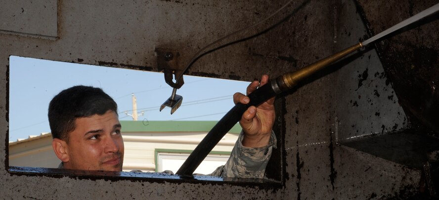 Staff Sgt. Kyle Pullum, 2nd Civil Engineer Squadron Heavy Repair section, cleans a street sweeper on Barksdale Air Force Base, La., April 25, 2013. Heavy Repair Airmen perform street sweeper duties in one-week shifts, cleaning streets and the flightline as needed depending on the conditions of the road. (U.S. Air Force photo/Airman 1st Class Andrew Moua)