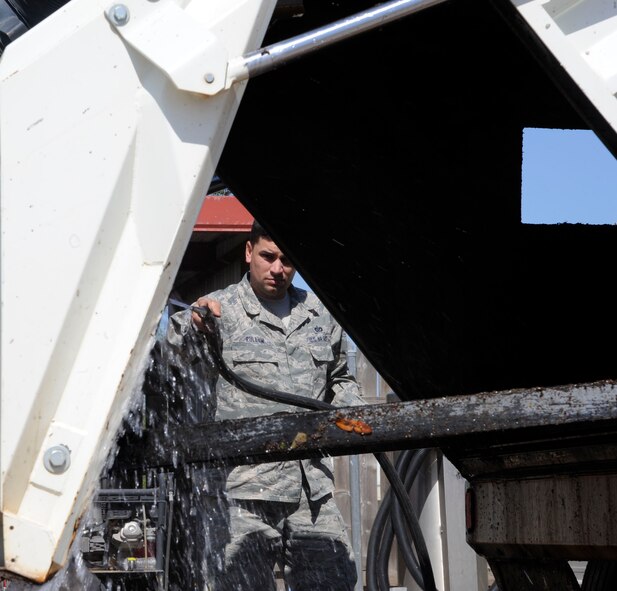 Staff Sgt. Kyle Pullum, 2nd Civil Engineer Squadron Heavy Repair section, cleans a street sweeper on Barksdale Air Force Base, La., April 25, 2013. Heavy Repair Airmen, also known as "Dirt Boys", lay down pavement, operate heavy equipment and maintain the roads and flightline in order to support Barksdale?s mission of delivering precision munitions to the battlefield. (U.S. Air Force photo/Airman 1st Class Andrew Moua)