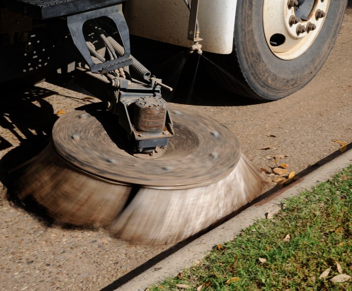 A street sweeper from the 2nd Civil Engineer Squadron Heavy Repair section cleans a road on Barksdale Air Force Base, La., April 25, 2013. Street sweepers help maintain Barksdale's infrastructure by removing dirt and debris from the roads, and more importantly, foreign object debris on the flightline. FOD is harmful to both personnel and aircraft alike since it can be sucked into an aircraft's engine or blown about and potentially cause injuries. (U.S. Air Force photo/Airman 1st Class Andrew Moua)