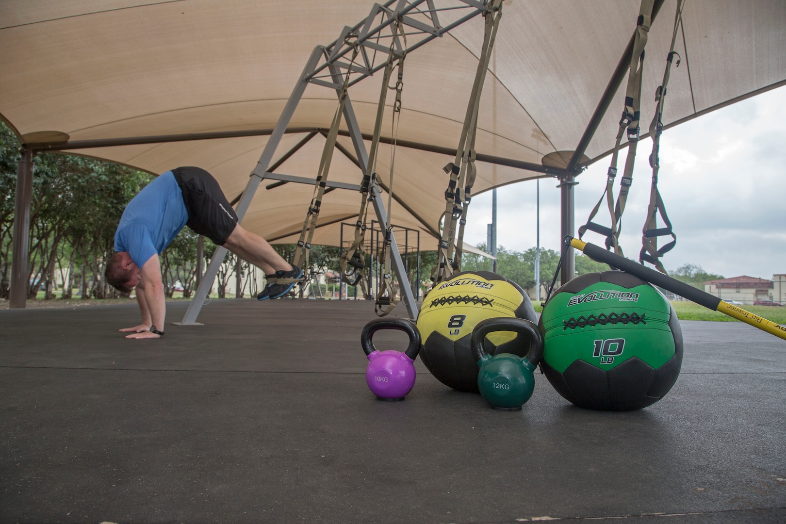 Keith Prince, a certified Total Resistance Exercise Level II instructor, completes a TRX workout at the Joint Base San Antonio-Randolph Rambler Fitness Center track and field April 17. (U.S. Air Force photo by Joshua Rodriguez/ Released)
