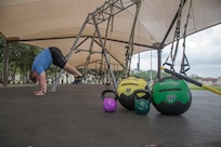 Keith Prince, a certified Total Resistance Exercise Level II instructor, completes a TRX workout at the Joint Base San Antonio-Randolph Rambler Fitness Center track and field April 17. (U.S. Air Force photo by Joshua Rodriguez/ Released)
