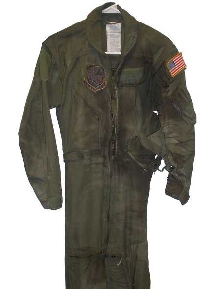 Still holding onto her scorched flight suit, Staff Sgt. Erica Luke said she was “beyond happy” that it worked as advertised. She said she had always been taught that a flight suit was fire-retardant up to 700 to 800 degrees. But she admitted she was surprised that it was able to deflect most of the flash fire that enveloped her. She now stores the charred flight suit in a shadow box … protecting it as it once protected her. (Courtesy photo)