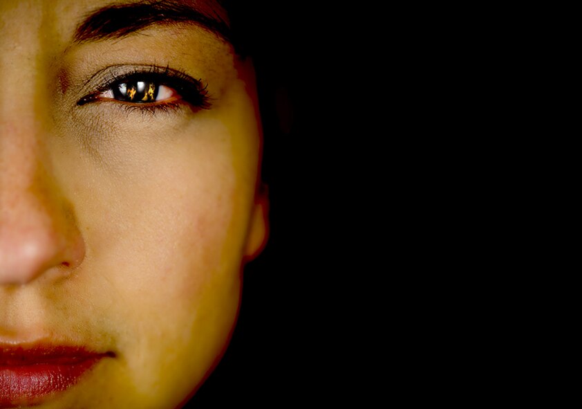 Long before the release of the hit song by Alicia Keys and the Hunger Games movie that further popularized the phrase, Staff Sgt. Erica Luke was the ‘Girl on Fire’ … literally (Photo by Tech. Sgt. Samuel Bendet / composite by Sammie W. King)