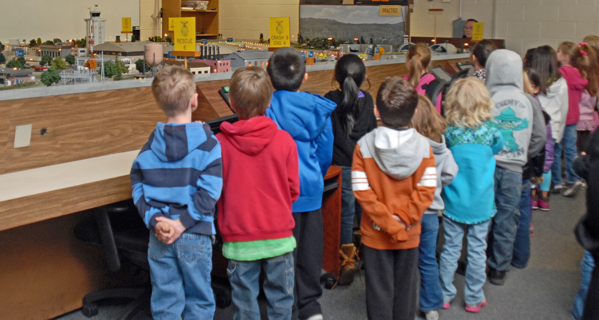 GOODFELLOW AIR FORCE BASE, Texas—Youths look at the Norma Brown trainer at the Louis F. Garland Fire Academy, here, April 23. The children visited Goodfellow from Santa Rita elementary school in San Angelo. 