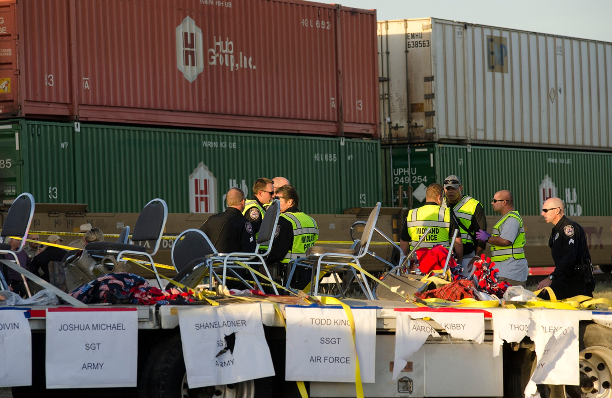 Midland police, fire and sheriffs respond to an accident where a semi trailer carrying veterans in a parade was struck by a train crossing Garfield. (Tim Fischer\Reporter-Telegram)