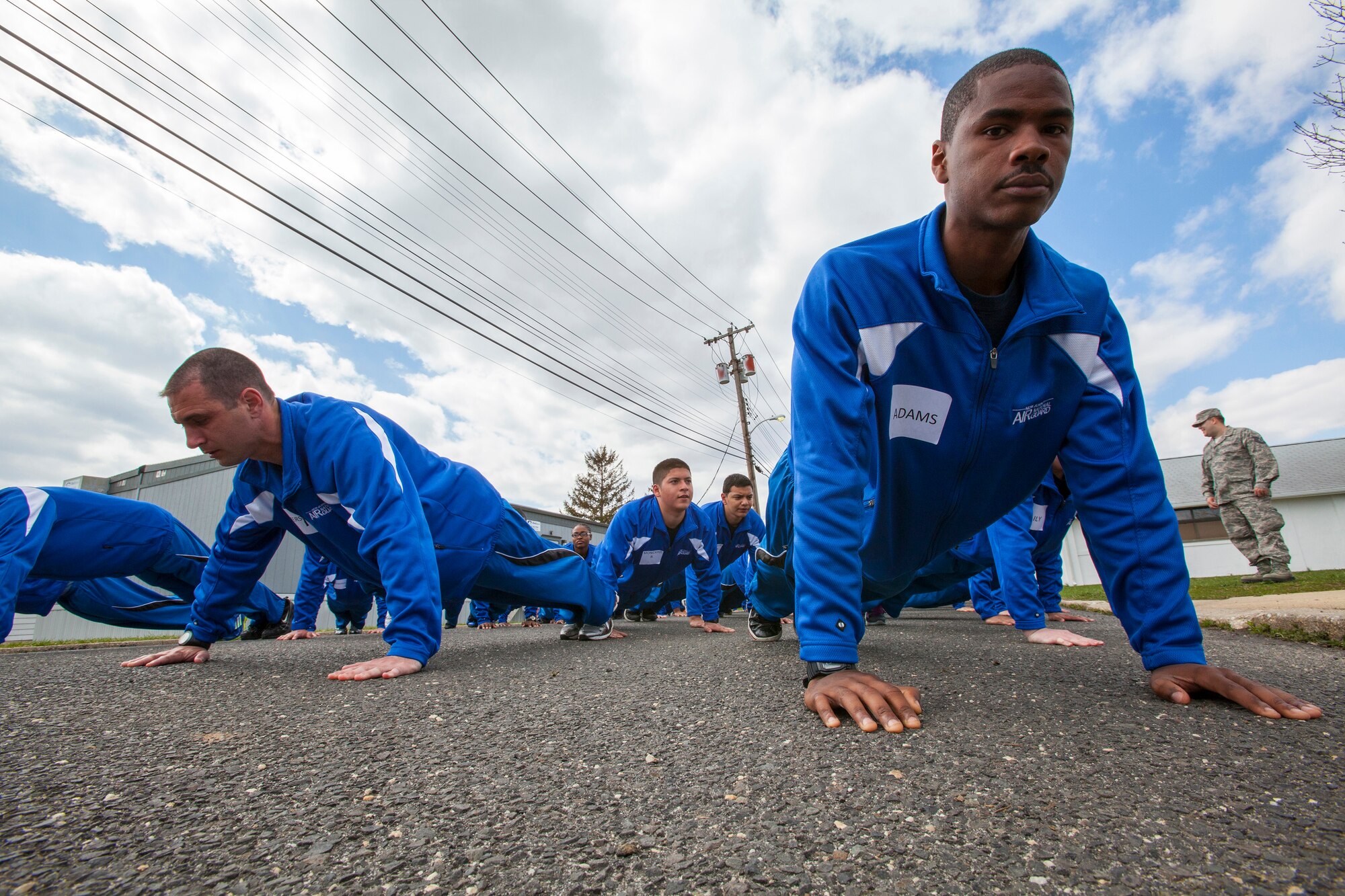 John J. Adams, right, 108th Wing Student Flight, practices his push-ups April 13, 2013, at the National Guard Training Center in Sea Girt, N.J. (U.S. Air National Guard photo by Master Sgt. Mark C. Olsen/Released)