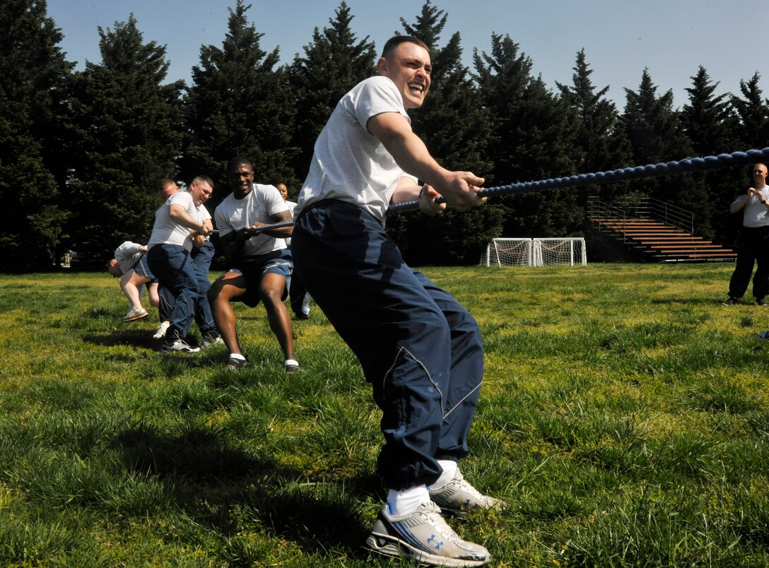 Airman 1st Class Daniel Czapski, U.S. Air Force ceremonial guardsman, participates in an 11th Operations Group tug-of-war competition during an 11 OG commander's call at Joint Base Anacostia-Bolling April 23, 2013. The commander's call presented the group with their quarter and annual awards in between scheduled recreational activities that raised money for the Air Force Assistance Fund as well as maintained the camaraderie and morale of all within the unit.  (U.S. Air Force photo/Senior Airman Lindsey A. Porter)