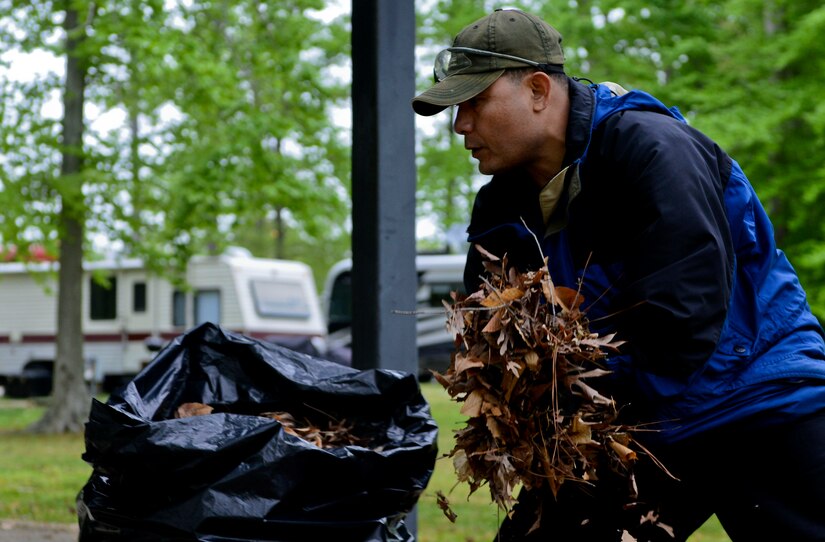 U.S. Army Master Sgt. Fred Jerry, 93rd Signal Brigade operations noncommissioned officer in charge, picks up leaves at the Outdoor Recreation Campground as Soldiers of the 93rd Signal Brigade cleaned the area in support of Earth Week at Fort Eustis, Va., April 23, 2013. The first Earth Day led to the creation of the U.S. Environmental Protection Agency and the passage of the Clean Air, Clean Water and Endangered Species Acts. (U.S. Air Force photo by Airman 1st Class R. Alex Durbin/Released)