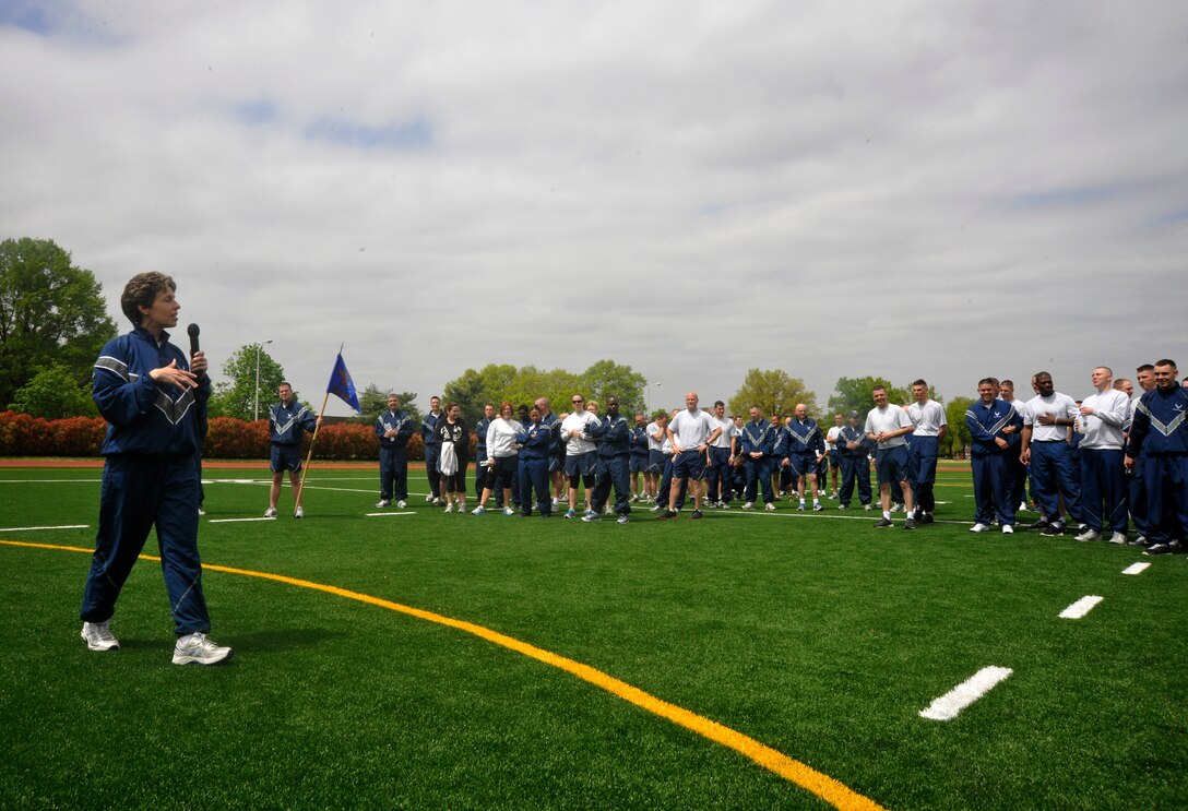 Col. Gina Humble, 11th Operations Group commander, leads an outdoor commander's call at Joint Base Anacostia-Bolling April 23, 2013. The commander's call was held in order to present the group with their quarter and annual awards as well as afford the group a venue to raise money for the Air Force Assistance Fund and maintain the camaraderie and morale of the unit. (U.S. Air Force photo/Senior Airman Lindsey A. Porter)(U.S. Air Force photo/Senior Airman Lindsey A. Porter)