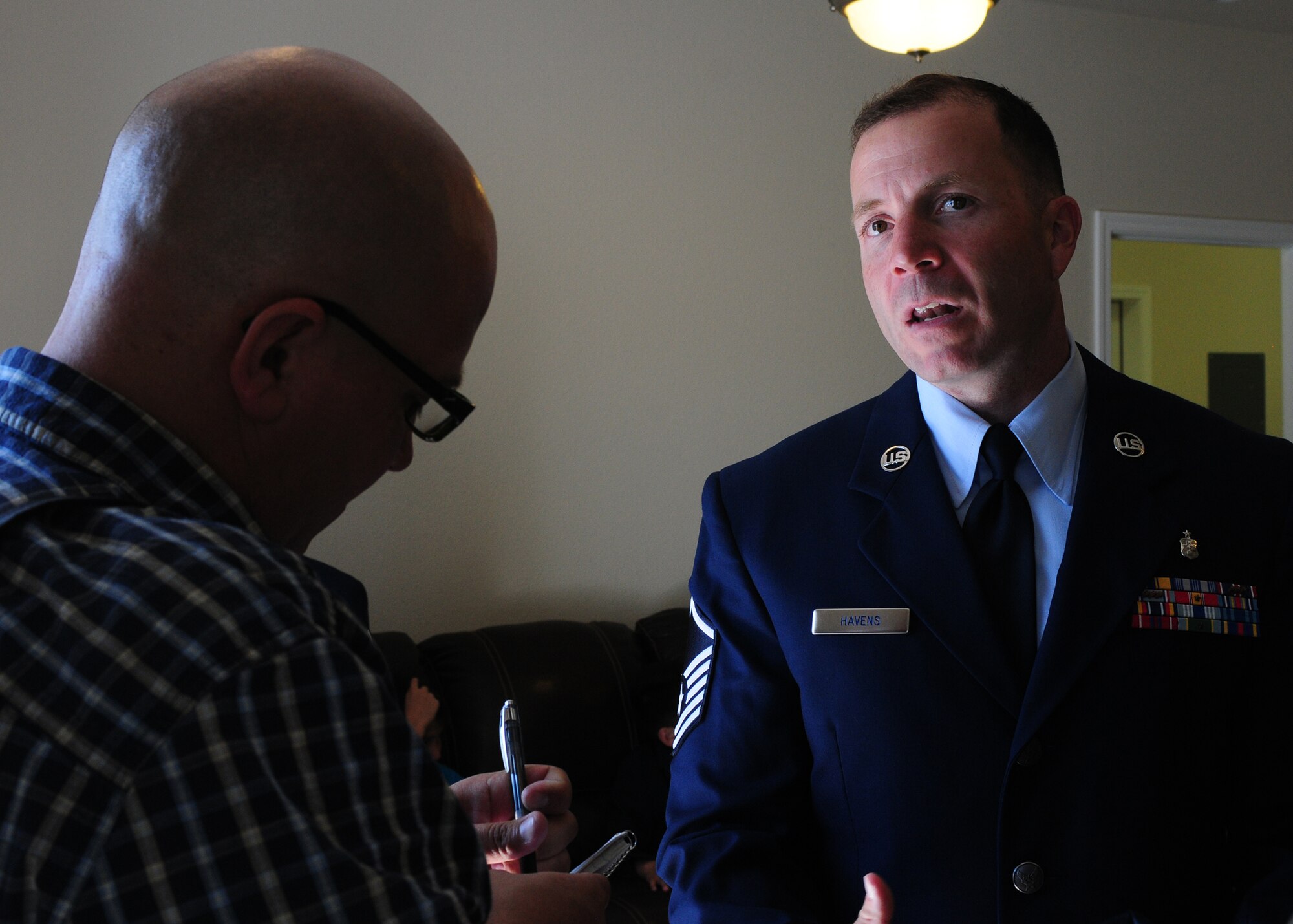 Master Sgt. Sonny Havens, 9th Physiological Support Squadron U-2 launch recovery technician, speaks to a local reporter about his thoughts on his new home at Beale Air Force Base Calif., April 24, 2013. The Havens have lived in base housing for the past 10 years. (U.S. Air Force photo by Senior Airman Allen Pollard/Released)