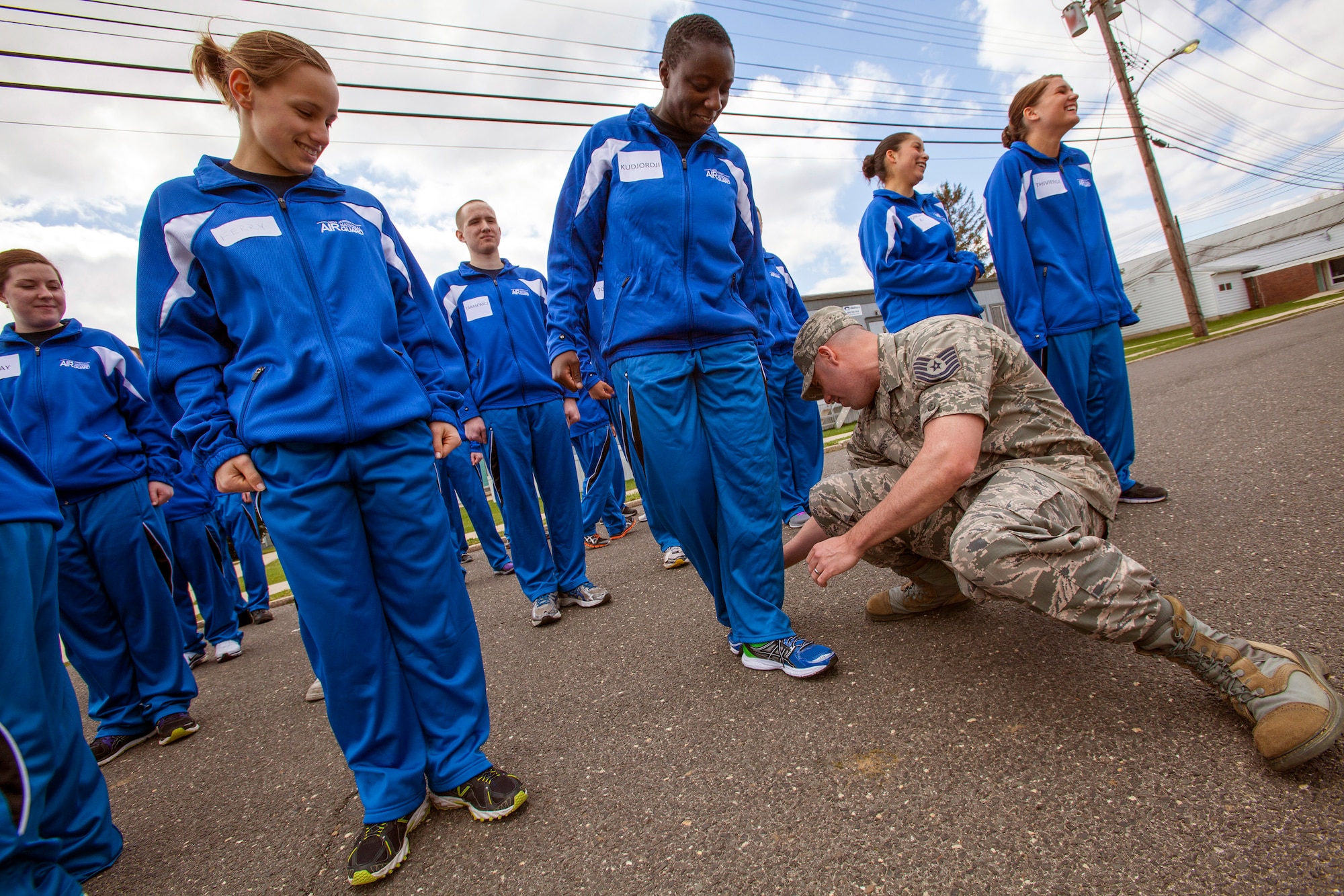 Tech. Sgt. James Morris, right, a recruiter with the 177th Fighter Wing, explains the about face movement to Edana A. Kudjordji, 108th Wing Student Flight, April 13, 2013, at the National Guard Training Center in Sea Girt, N.J. Forty-four members of the New Jersey Air National Guard Student Flight spent a weekend in a simulated basic training environment preparing them for military culture April 13 and 14. (U.S. Air National Guard photo by Master Sgt. Mark C. Olsen/Released)