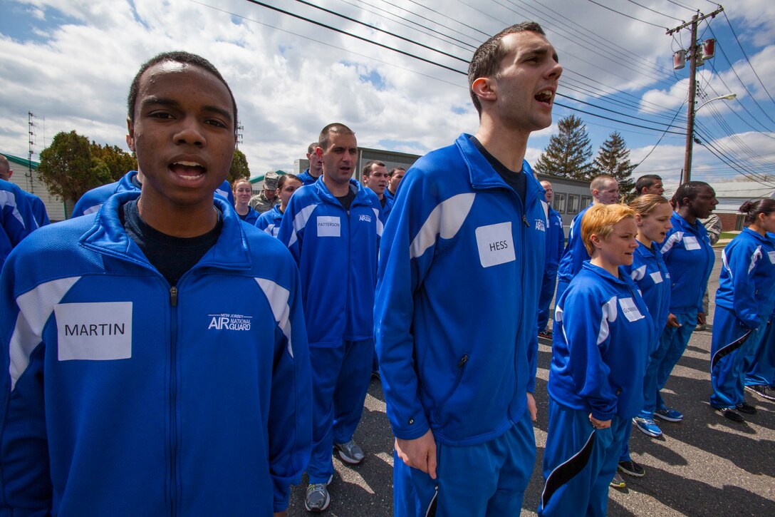 Tyler M. Martin, left, along with James R. Hess, right, both members of the 108th Wing Student Flight, yell cadence during drill and ceremony practice April 13, 2013, at the National Guard Training Center in Sea Girt, N.J. Forty-four members of the New Jersey Air National Guard Student Flight spent a weekend in a simulated basic training environment preparing them for military culture April 13 and 14.  Student Flight is comprised of 33 enlistees from the 108th Wing and 11 from the 177th Fighter Wing.  Student Flight gives new enlistees a head start on basic military training, making the transition from civilians into Airmen easier from the time of enlistment until the time they leave for BMT.  They drill as trainees -- their title throughout BMT -- during regular unit training assemblies at the Wings and are paid at whatever grade in which they enlisted.  The Student Flight program covers topics such as reporting procedures, drill and ceremony, physical training and the U.S. Air Force mission, vision and core values.  (U.S. Air National Guard photo by Master Sgt. Mark C. Olsen/Released)