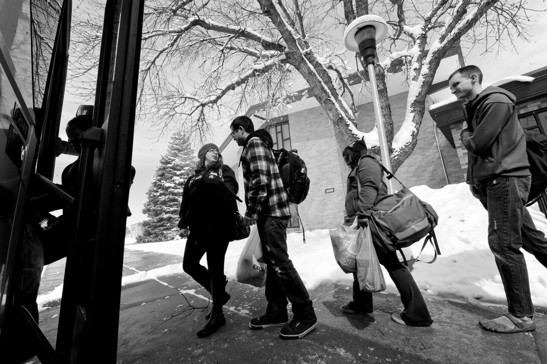 Base Airmen and their spouses board a bus at Ellsworth Air Force Base, S.D. April 18, 2013 prior to heading to Denver for a marriage care retreat hosted by the 28th Bomb Wing Chapel staff. The four-day retreat consisted of seminars focused on strengthening their relationships with each other and a night out to see “The Blue Man Group,” all while enjoying the sights of Denver. (U.S. Air Force photo by Airman 1st Class Anania Tekurio/Released) 