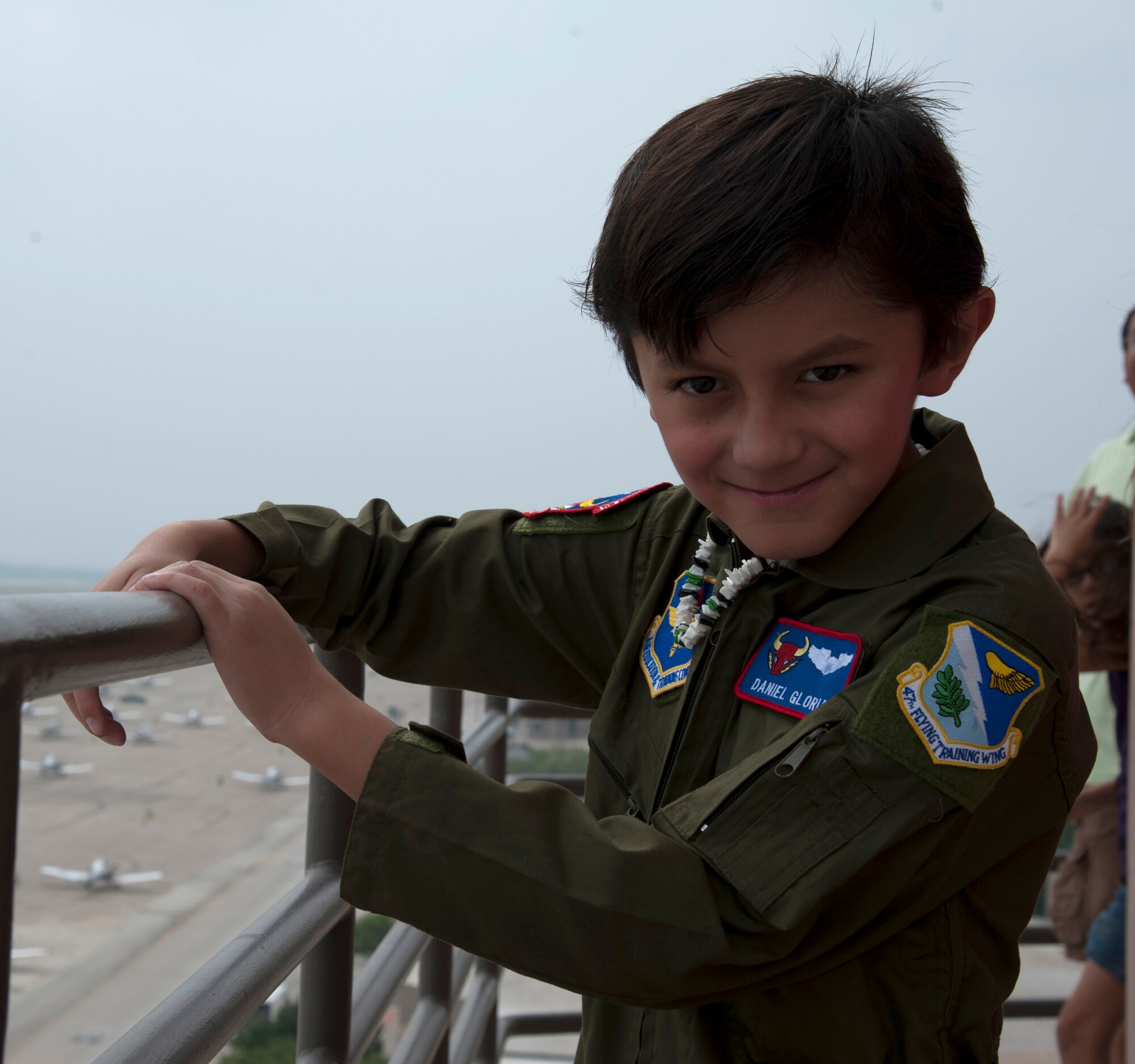 Daniel Gloria, honorary pilot for a day, poses for a photo during a tour of the flight line on Laughlin Air Force Base, Texas, April 17, 2013. The Pilot for a Day program gives terminally ill or disabled children the opportunity to experience a day in the life of a pilot. (U.S. Air Force photo/Airman 1st Class Jimmie Pike)