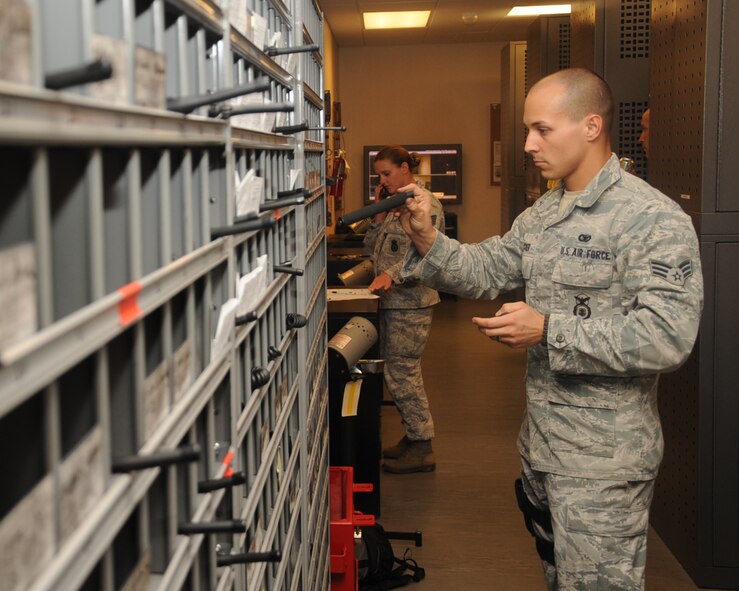 Senior Airman Steven Mucker, 2nd Security Forces Squadron staff armorer, puts away Air Force Form 629s at the armory on Barksdale Air Force Base, La., April 24, 2013.  The forms are used to maintain accountability of equipment issued to Airmen. (U.S. Air Force photo/Senior Airman Sean Martin)