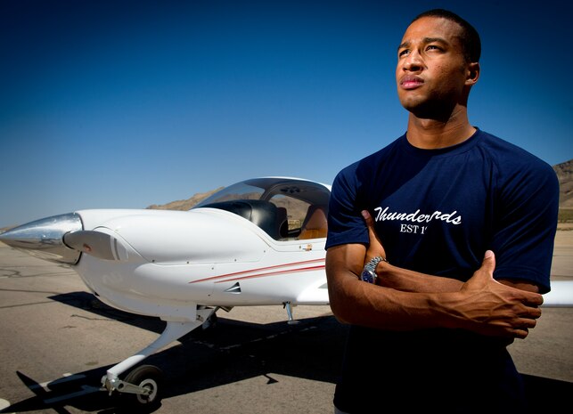 Staff Sgt. Benjamin Ayivorh, Thunderbird 7 dedicated crew chief, stands in front of his DA-40 aircraft at Jean Airport, Nev., April 22, 2013. Ayivorh's father inspired him to earn a private pilot’s license. (U.S. Air Force photo by Tech. Sgt. Manuel J. Martinez)