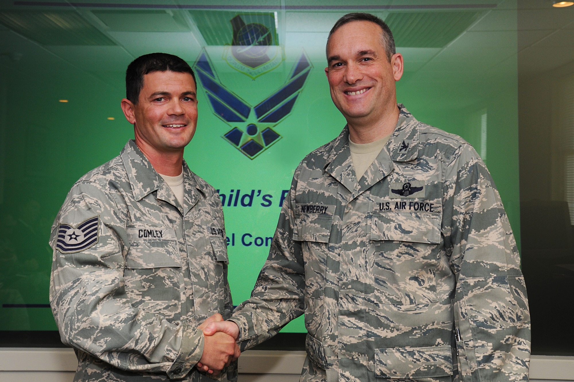 Tech. Sgt. Michael Comley, 22nd Training Squadron flight chief, poses for a photo with Col. Brian Newberry, 92nd Air Refueling Wing commander, at Fairchild Air Force Base, Wash., April 24, 2013. Comley has been selected as a member of Fairchild’s Finest. (U.S. Air Force photo by Airman 1st Class Janelle Patiño/Released)