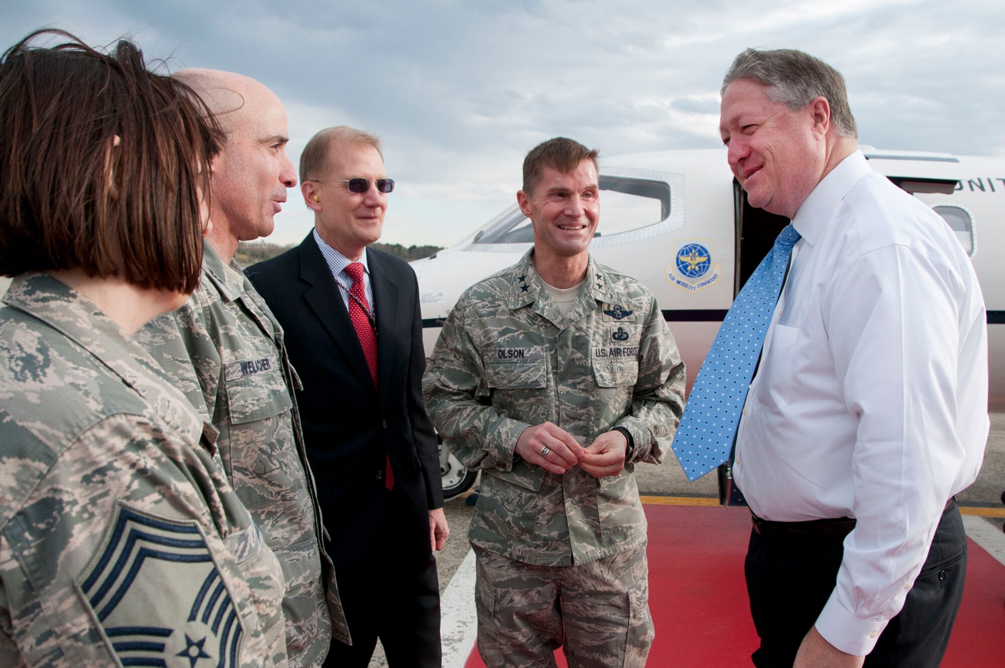 HANSCOM AIR FORCE BASE, Mass. -- Secretary of the Air Force Michael Donley arrives here April 25 and is greeted by Maj. Gen. Craig Olson, program executive officer for Command, Control, Communications, Intelligence and Networks, Steve Wert, program executive officer for Battle Management, Col. Lester Weilacher, 66th Air Base Group Commander, and Chief Master Sgt. Cindy Rainey, 66th Medical Squadron superintendent. During his visit, Donley met with military and civilian award winners, received briefings and technology demonstrations and held an Airman's call with base personnel. He also traveled to Cambridge, Mass., where he received the 2013 Doolittle Award from the MIT Security Studies Program. (U.S. Air Force Photo by Mark Wyatt)