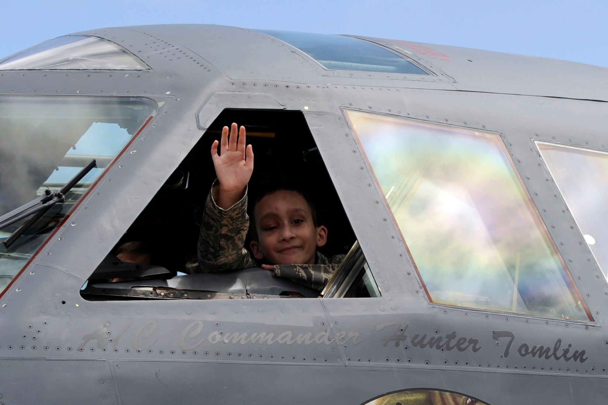Honorary Colonel Hunter Tomlin waves to his parents and a crowd below from the cockpit of his own B-52 Stratofortress at Barksdale Air Force base, La., April 24, 2013. Hunter, who has Neurofibromatosis Type 1, also known as von Recklinghausen disease, is recovering from surgery performed to remove a tumor from his face that hindered his ability to breathe through his nose. Members of the 307th AMXS and 2nd Aircraft Maintenance Squadron made Hunter’s dream come true by presenting him with an Air Force uniform, a tour of a B-52 Stratofortress and mementos of his visit to Barksdale. He was made an honorary colonel and B-52 crew chief during his visit. The honorary positions just might make Hunter the youngest, if not only, honorary colonel, honorary crew chief in the United States Air Force. (U.S. Air Force photo by Master Sgt. Jeff Walston)