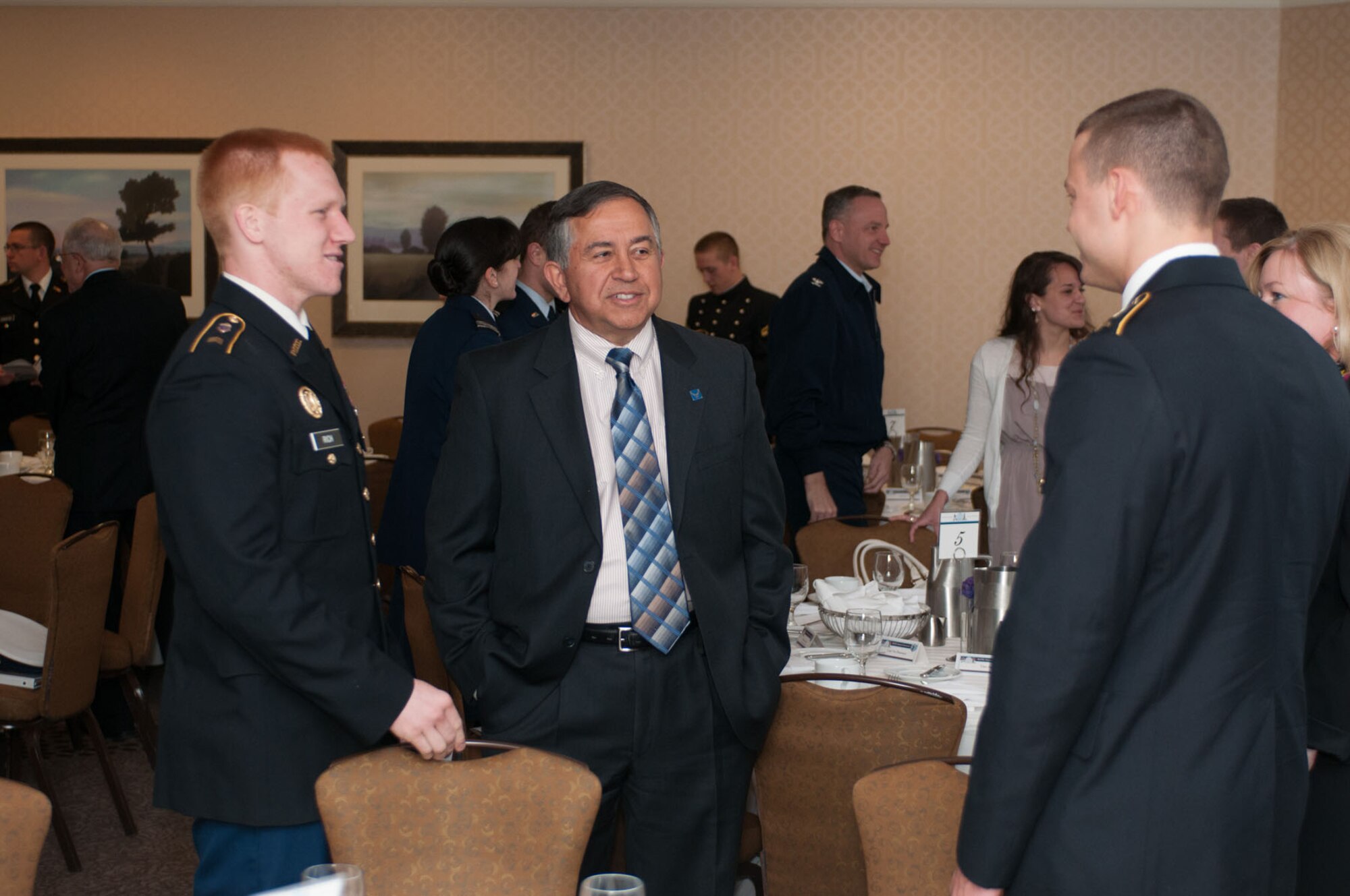 BEDFORD, Mass. -- Joe Magnone, Northrop Grumman Corporation, talks to Army Cadets Weston Rich and Christopher Tornton at the Armed Forces Communications and Electronics Association and Association of Old Crows ROTC Scholarship luncheon at the Bedford Doubletree Hotel April 18. Twenty-Eight scholarships were awarded to ROTC cadets and midshipmen that attend colleges and universities in the New England area. (U.S. Air Force photo by Rick Berry)