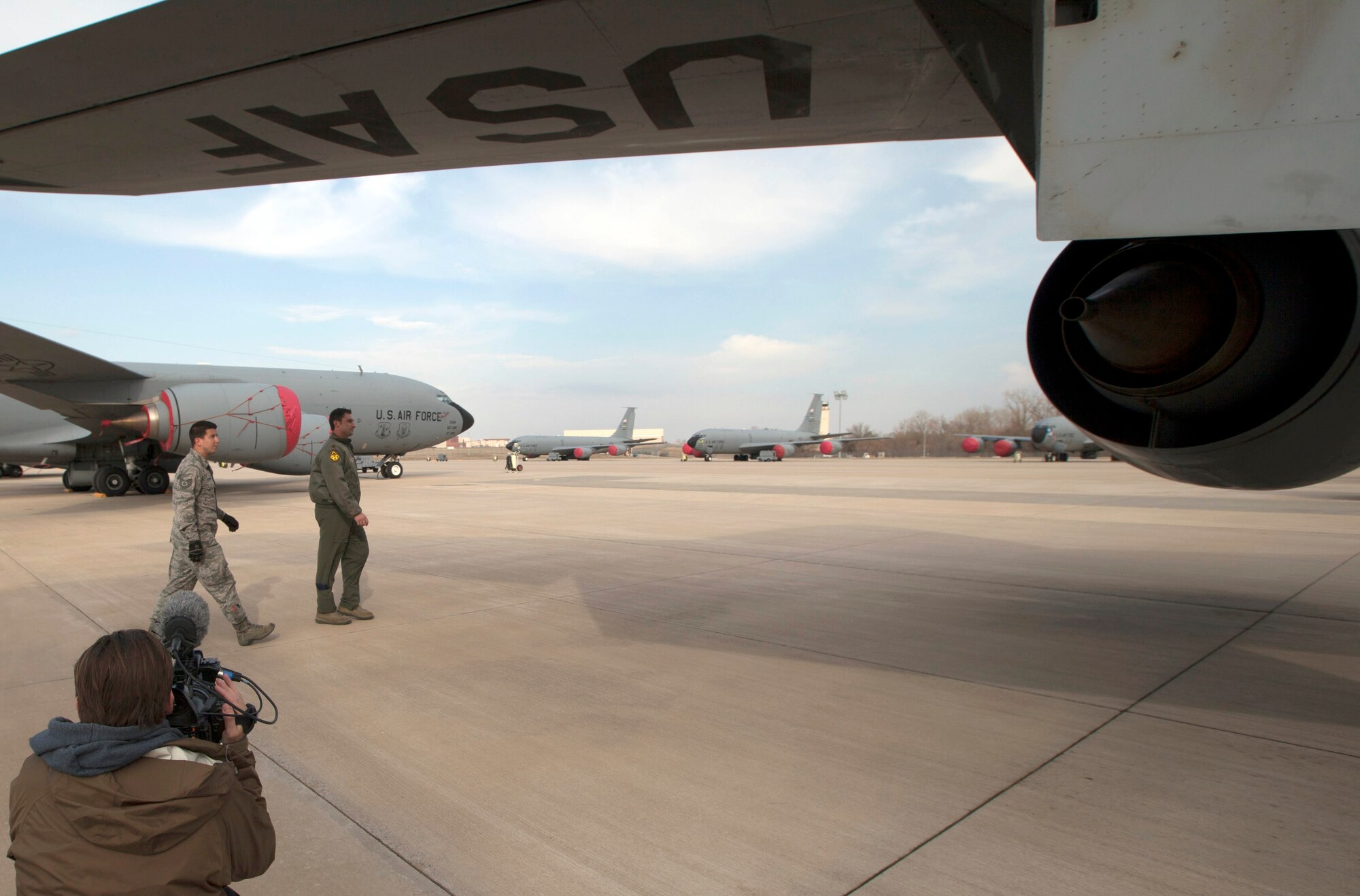 Maj. Mark Povec, a KC-135 pilot from the 465th Air Refueling Squadron, performs a pre-flight inspection with Tech. Sgt. Michael Dudzinski, 137th Air Refueling Wing, Oklahoma Air National Guard, as Devin Lund, director of photography on the television show, “The Aviators” films. The documentary film crew recently spent two days at Tinker Air Force Base highlighting the KC-135 Stratotanker and the E-3 Sentry missions for an episode to air in October. (Air Force photo by Megen Andersen, The Aviators production coordinator)
