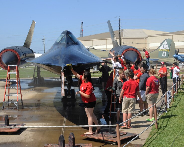 Students from the Haughton High School Junior Reserve Officer Training Corps clean an SR-71 Blackbird at the Barksdale Global Power Museum on Barksdale Air Force Base, La., April 24, 2013. The Haughton JROTC adopted the aircraft and will be responsible for its maintenance and upkeep. The museum has 13 aircraft that need to be adopted. (U.S. Air Force photo/Senior Airman Sean Martin)