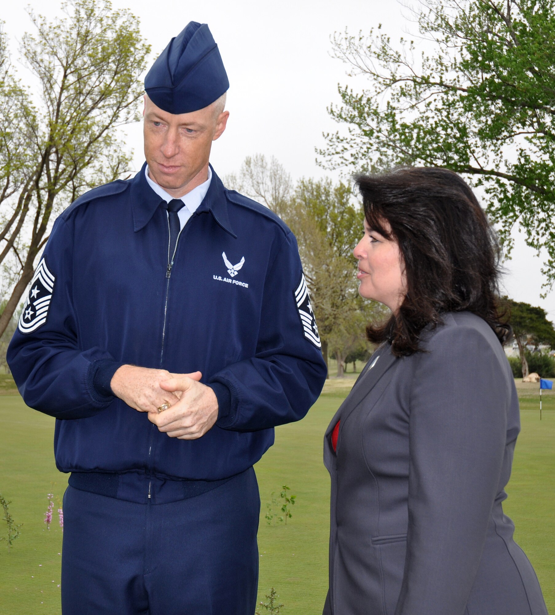 Cathy Clark-Fleck, 72nd Force Support Squadron Community Services Flight chief, tells Air Force Materiel Command Chief Master Sgt. Michael Warner about the turnaround at the Tinker Golf Course. With the course on the brink of closure, the staff changed the way it did business by cutting costs and putting money back into the operation. The result was almost 12,000 more rounds of golf played on the Tinker course in fiscal 2012 than in fiscal 2011. (Air Force photo by Becky Pillifant)
