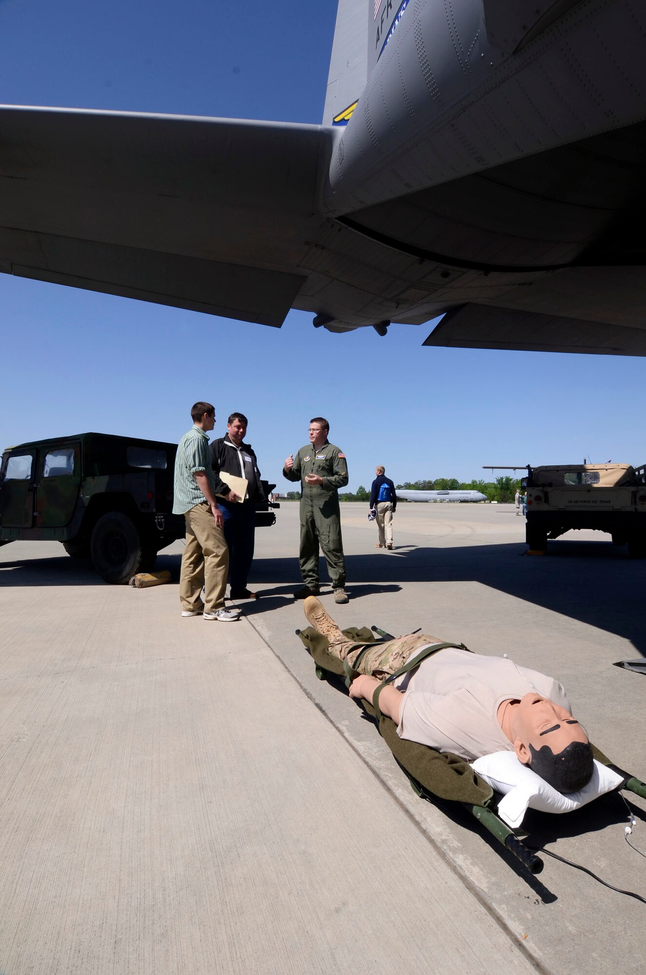 Tech Sgt. Joshua C. Albertin, Medical Technician from the 94th Aeromedical Squadron explains the function of the high-fidelity patient simulator, or IStan, and mission of the Aeromedical teams  to students and family members attending the 2013 Georgia Congressional Delegation Academy Day held at Dobbins Air Reserve Base, Ga., April 20. (U.S. Air Force photo/Don Peek)