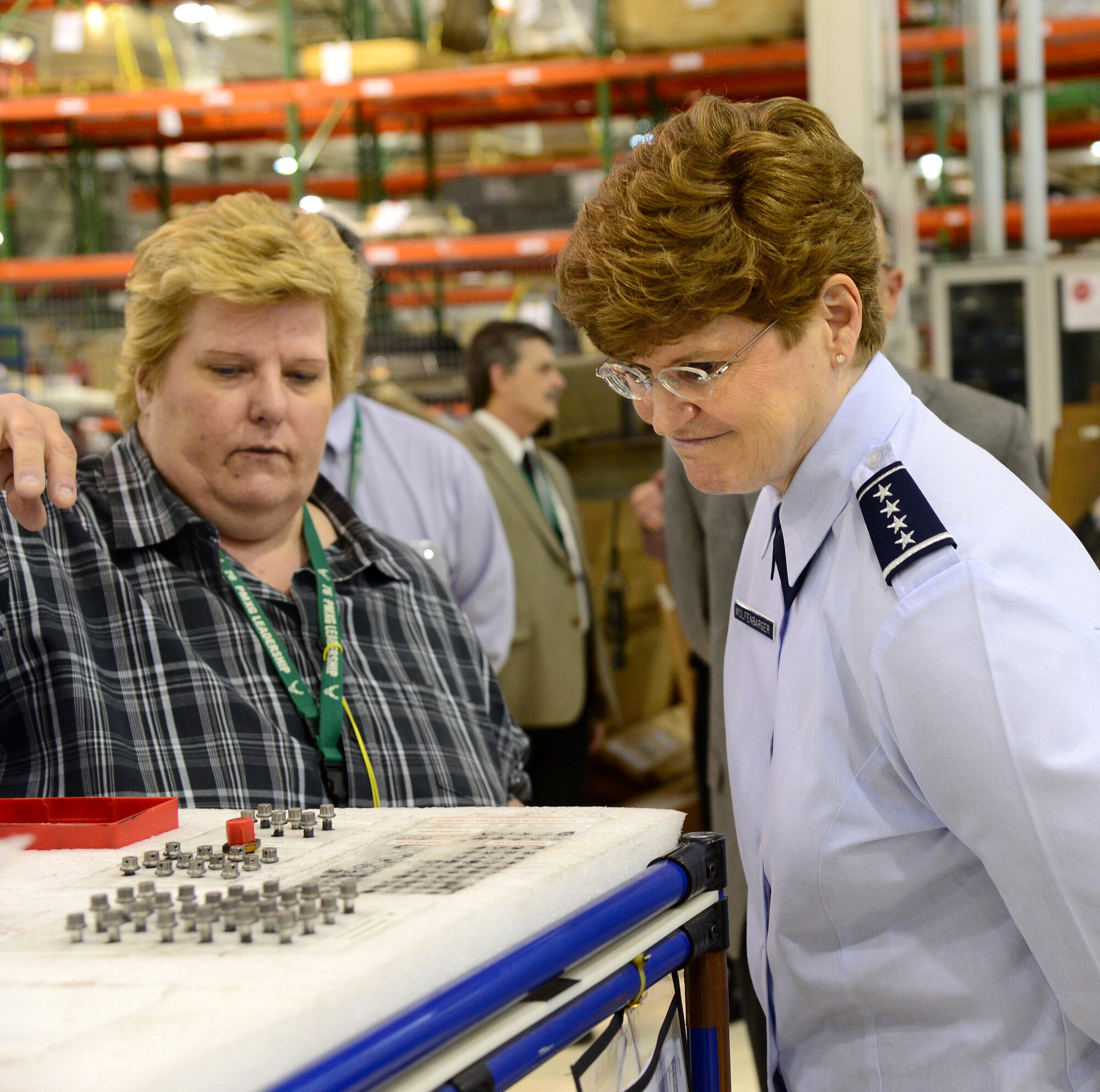 Debbie Patterson, a supervisor with the 546th Propulsion Maintenance Squadron, explains to Gen. Janet Wolfenbarger, commander of Air Force Materiel Command, about the F108 engine line’s kitting cart system, and how the recently leaned-down process of using them has become a vital part of her organization’s success.   Touring the F108 line of Bldg. 9001 was one of the highlighted stops for the general on Tuesday, allowing her to see Tinker’s process improvement in action. Additional coverage on page 2. (Air Force photo by Kelly White)