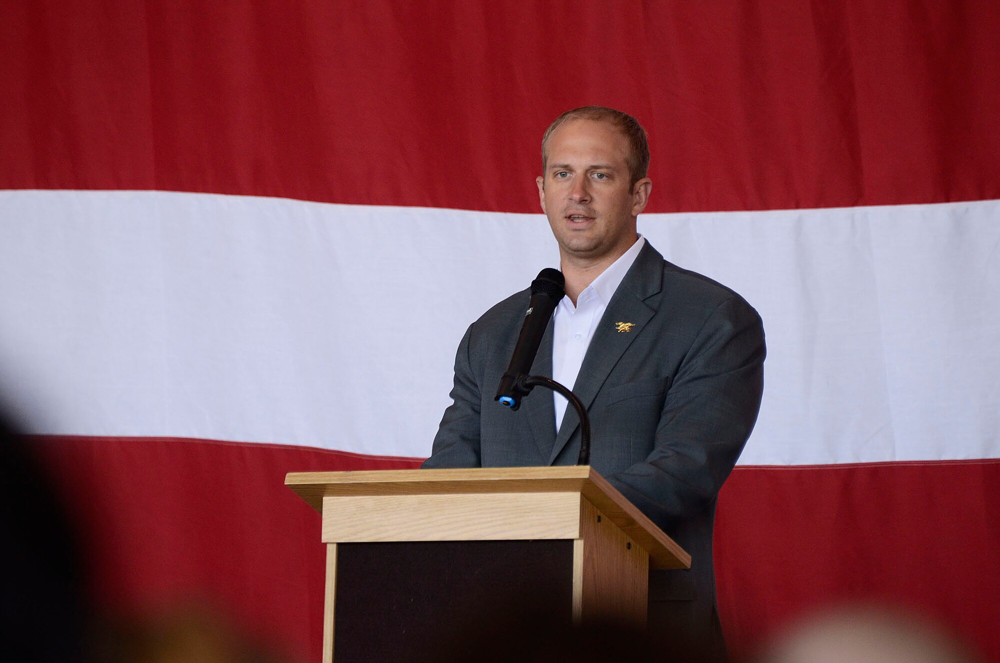 Jared Ogden, former U.S. Navy Seal speaks to students and family members about the academy experience and the valuable opportunities offered through the various services during the 2013 Georgia Congressional Delegation Academy Day held at Dobbins Air Reserve Base, Ga., and April 20. (U.S. Air Force photo/Don Peek)