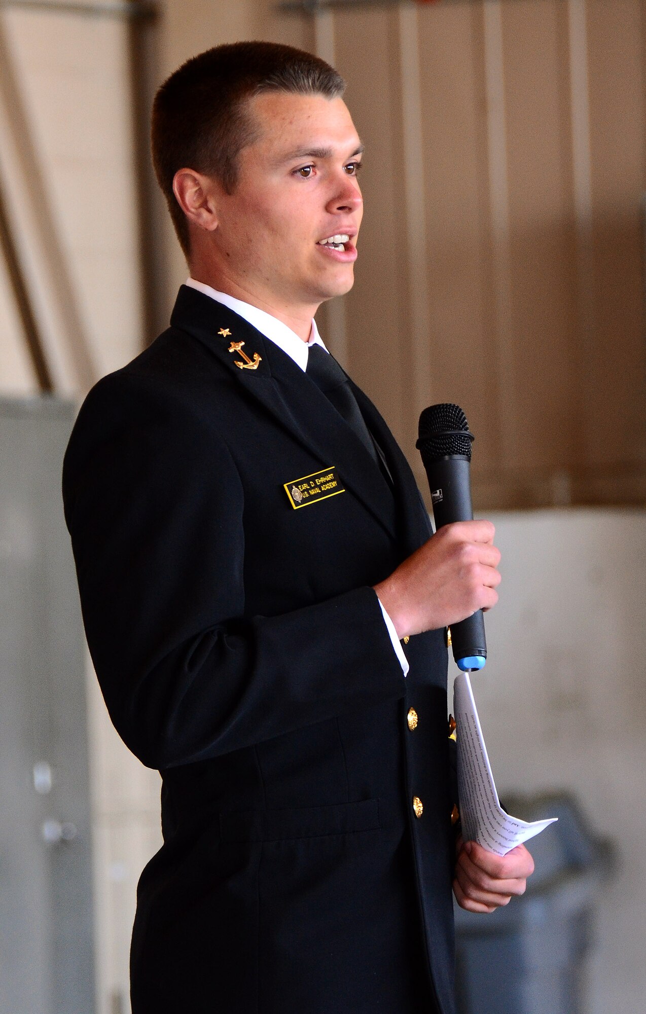 A midshipman from the U.S. Naval Academy speaks to students and family members about the academy application experience during the 2013 Georgia Congressional Delegation Academy Day held at Dobbins Air Reserve Base, Ga., April 20. (U.S. Air Force photo/Brad Fallin)