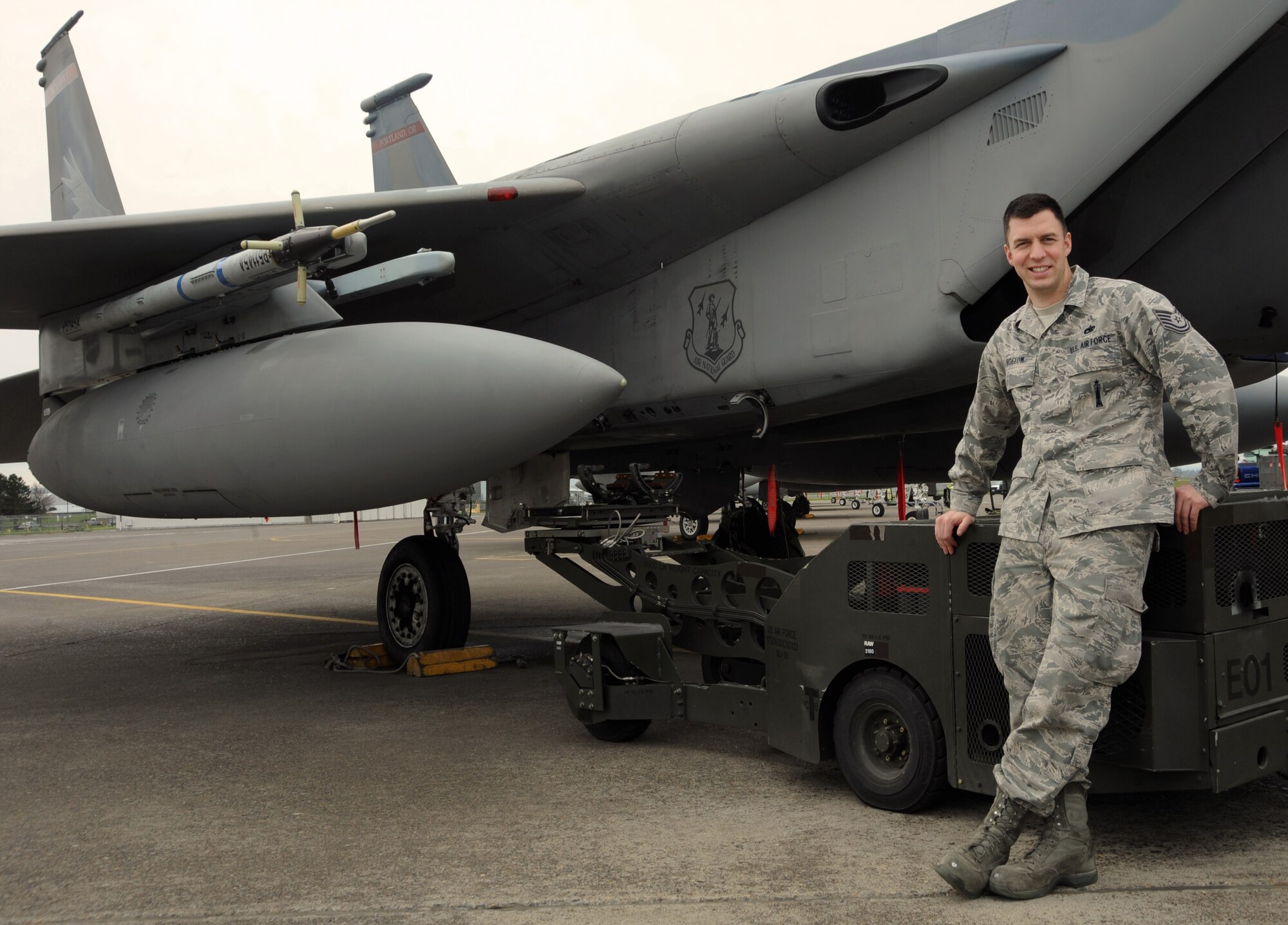 U.S. Air Force Tech. Sgt. Jordan Bigelow pauses for a photograph at the Portland Air National Guard Base, Portland, Ore., April 4, 2013. Sean Bigelow has been with the 142nd Fighter Wing for more than 10 years, working as a weapons loader on the F-15 Eagle. (Air National Guard photo by Tech. Sgt. John Hughel, 142nd Fighter Wing Public Affairs Office)