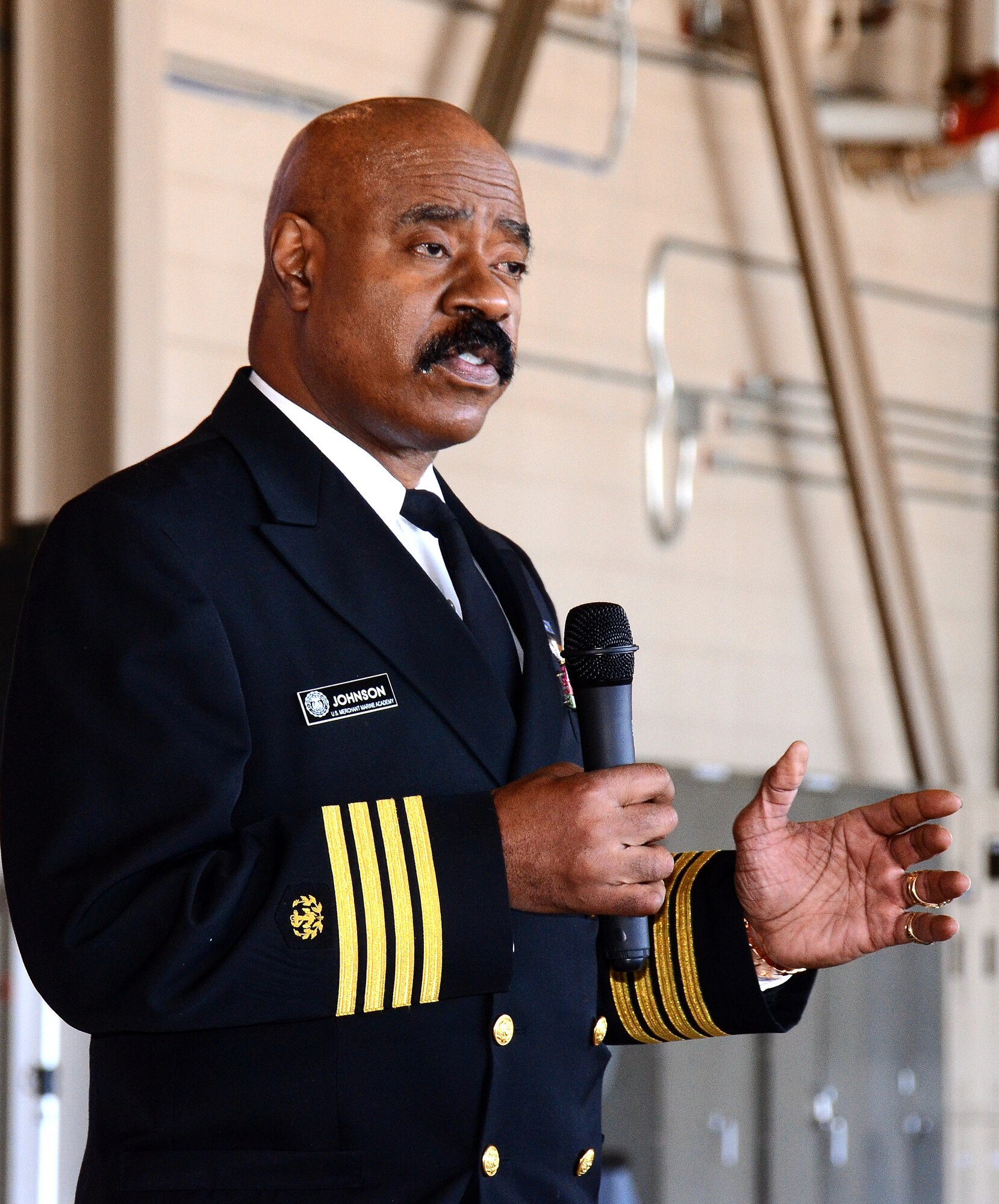 Capt. Robert Johnson, Admissions Director from the U.S. Merchant Marine Academy speaks to students and family members about the academy application experience during the 2013 Georgia Congressional Delegation Academy Day held at Dobbins Air Reserve Base, Ga., April 20. (U.S. Air Force photo/Brad Fallin)