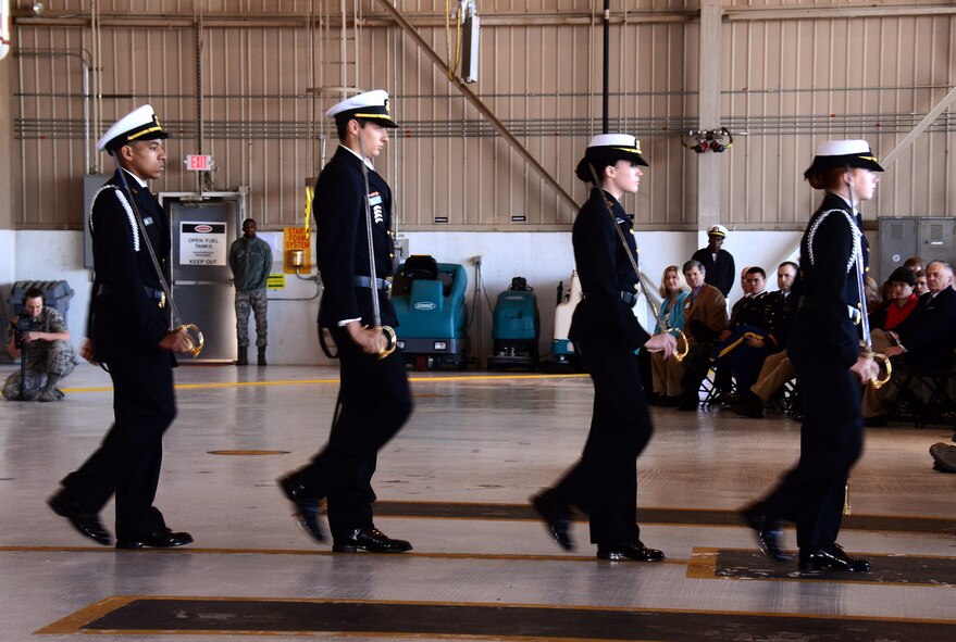 Senior members of the Lassiter-Pope-Kell Naval Junior ROTC Drill Team perform at the 2013 Academy Day at Dobbins Air Reserve Base, Ga., April 20. The event allows high school students the opportunity to meet with representatives from each of the service academies, including West Point, the U.S. Naval Academy, the U.S. Air Force Academy, the Coast Guard Academy, and the U.S. Merchant Marines Academy. (U.S. Air Force photo/Brad Fallin)