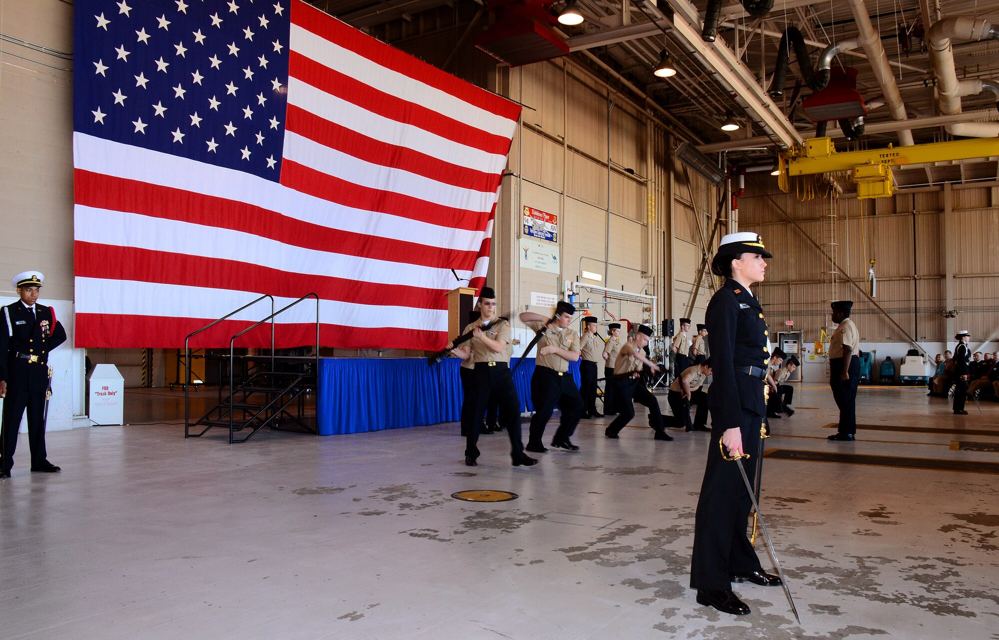 The Lassiter-Pope-Kell Naval Junior ROTC Drill Team performs at the 2013 Academy Day at Dobbins Air Reserve Base, Ga., April 20. The event allows high school students the opportunity to meet with representatives from each of the service academies, including West Point, the U.S. Naval Academy, the U.S. Air Force Academy, the Coast Guard Academy, and the U.S. Merchant Marines Academy. (U.S. Air Force photo/Brad Fallin)