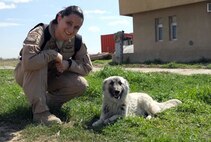 In 2011, a then, Capt. Kristen Ellis found a new mission in Iraq by helping rescue a mother and her pups from certain destruction. Here Ellis poses with Fatoon, who just celebrated two years living in the United States. (USAF courtesy photo)
 