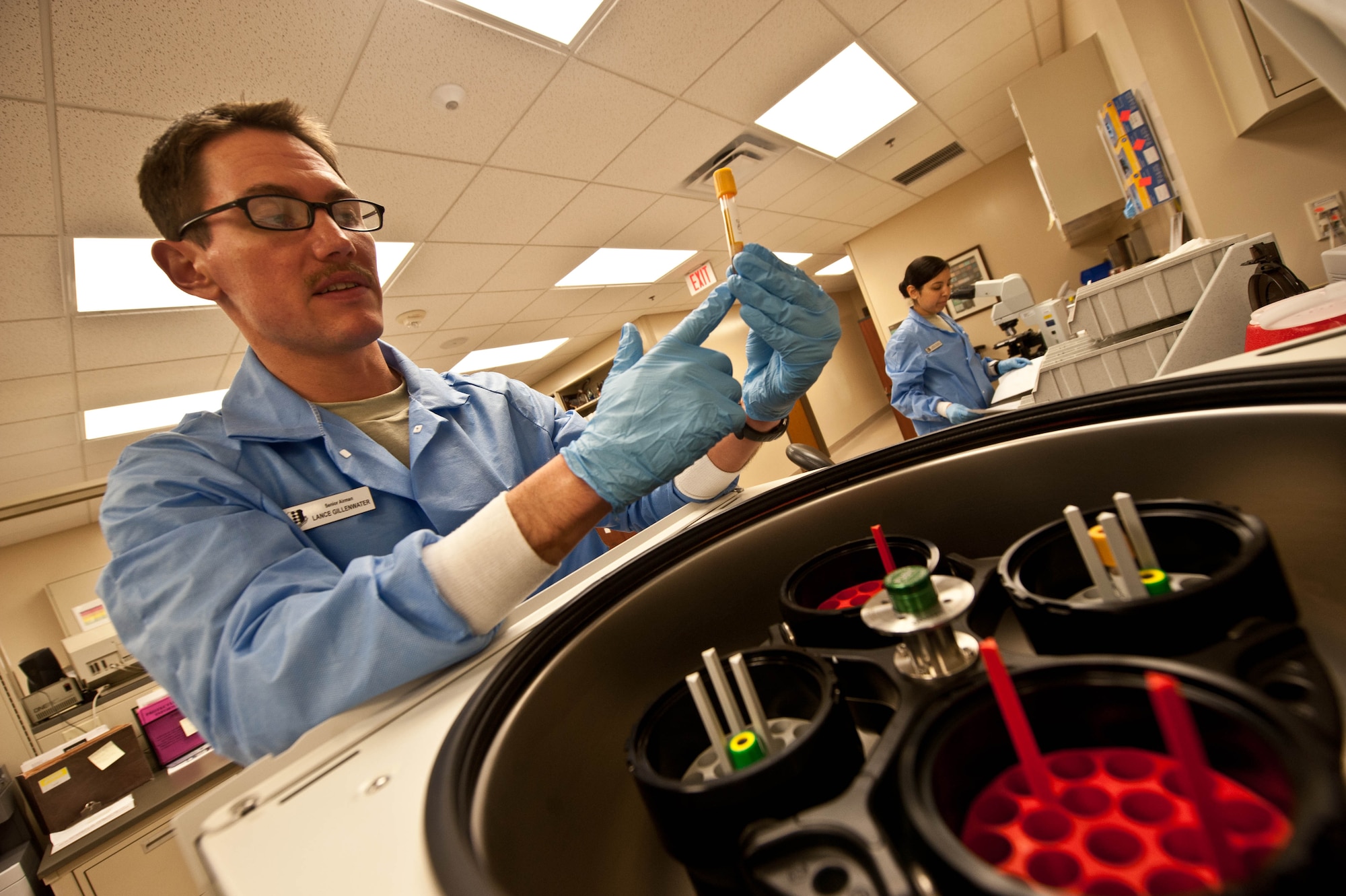 Senior Airman Lance Gillenwater, 28th Medical Support Squadron medical laboratory technician, examines a blood processed through a centrifuge in the clinical laboratory at Ellsworth Air Force Base, S.D., April 19, 2013. Medical laboratory technicians, conduct procedures to identify bacteria and determine antibiotic sensitivity of pathogenic microorganisms. (U.S. Air Force photo by Airman 1st Class Zachary Hada/Released)