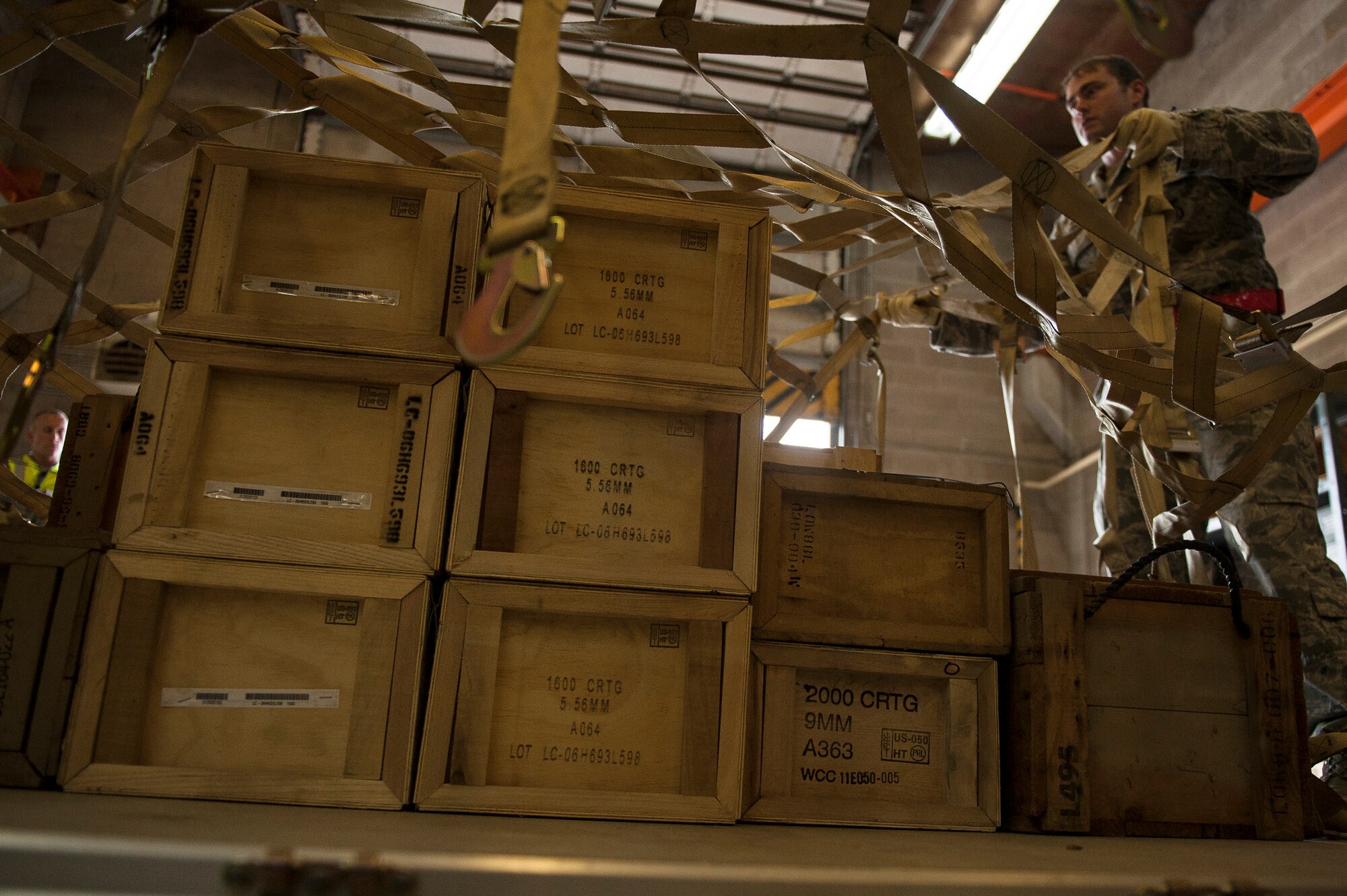 Staff Sgt. Jacob Workman, 19th Security Forces Squadron, secures the contents of a pallet during the ROCKEX April 23, 2013, at Little Rock Air Force Base, Ark. The four day exercise tested the ability of units across the 19th Airlift Wing to deploy in support of contingency and humanitarian operations around the world.     (U.S. Air Force photo by Staff Sgt. Russ Scalf)