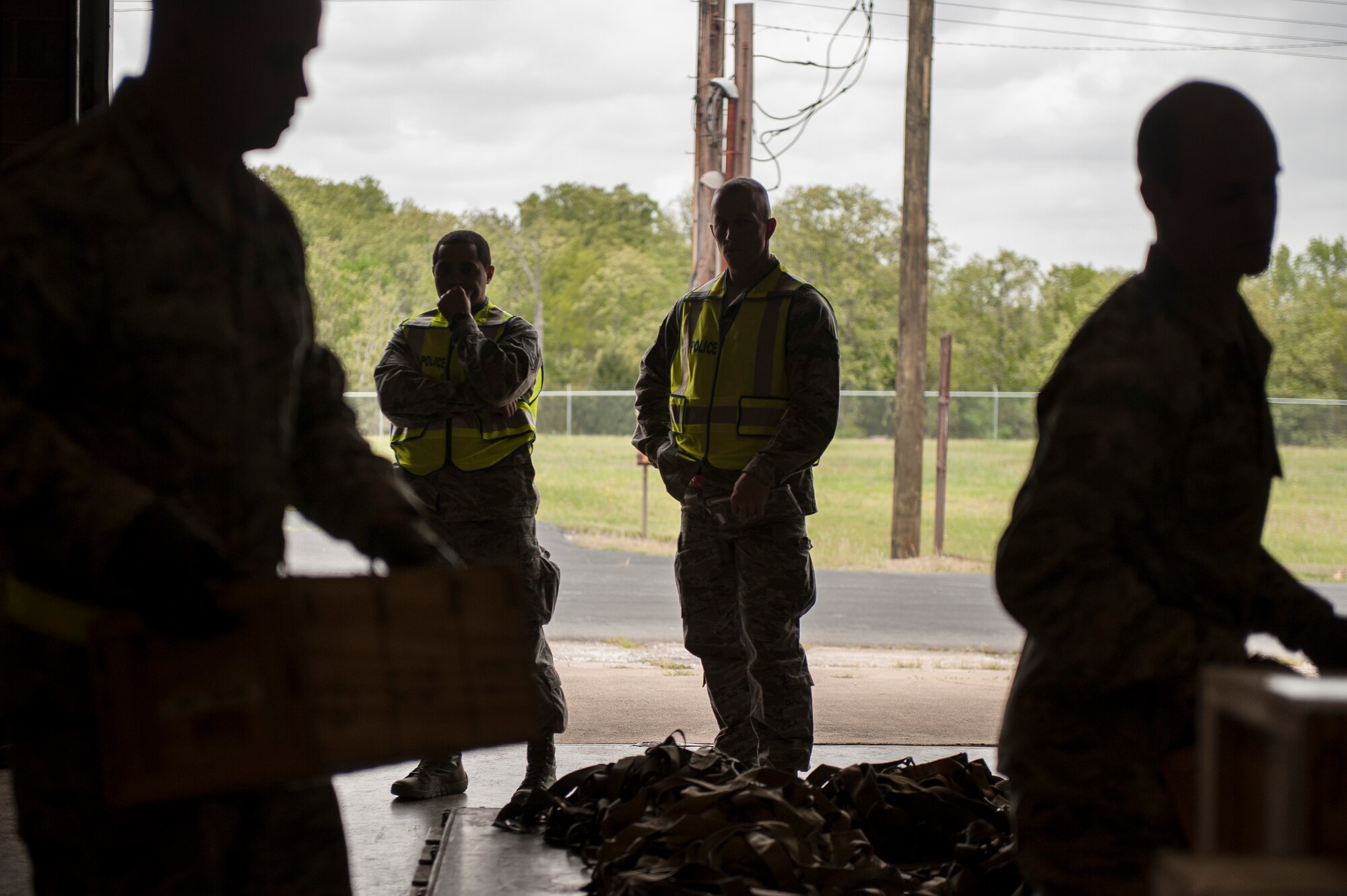 Observers watch Airmen from the 19th Security Forces Squadron build a pallet during the ROCKEX April 23, 2013, at Little Rock Air Force Base, Ark. The observers were looking for ways to improve efficiency for future events. (U.S. Air Force photo by Staff Sgt. Russ Scalf)