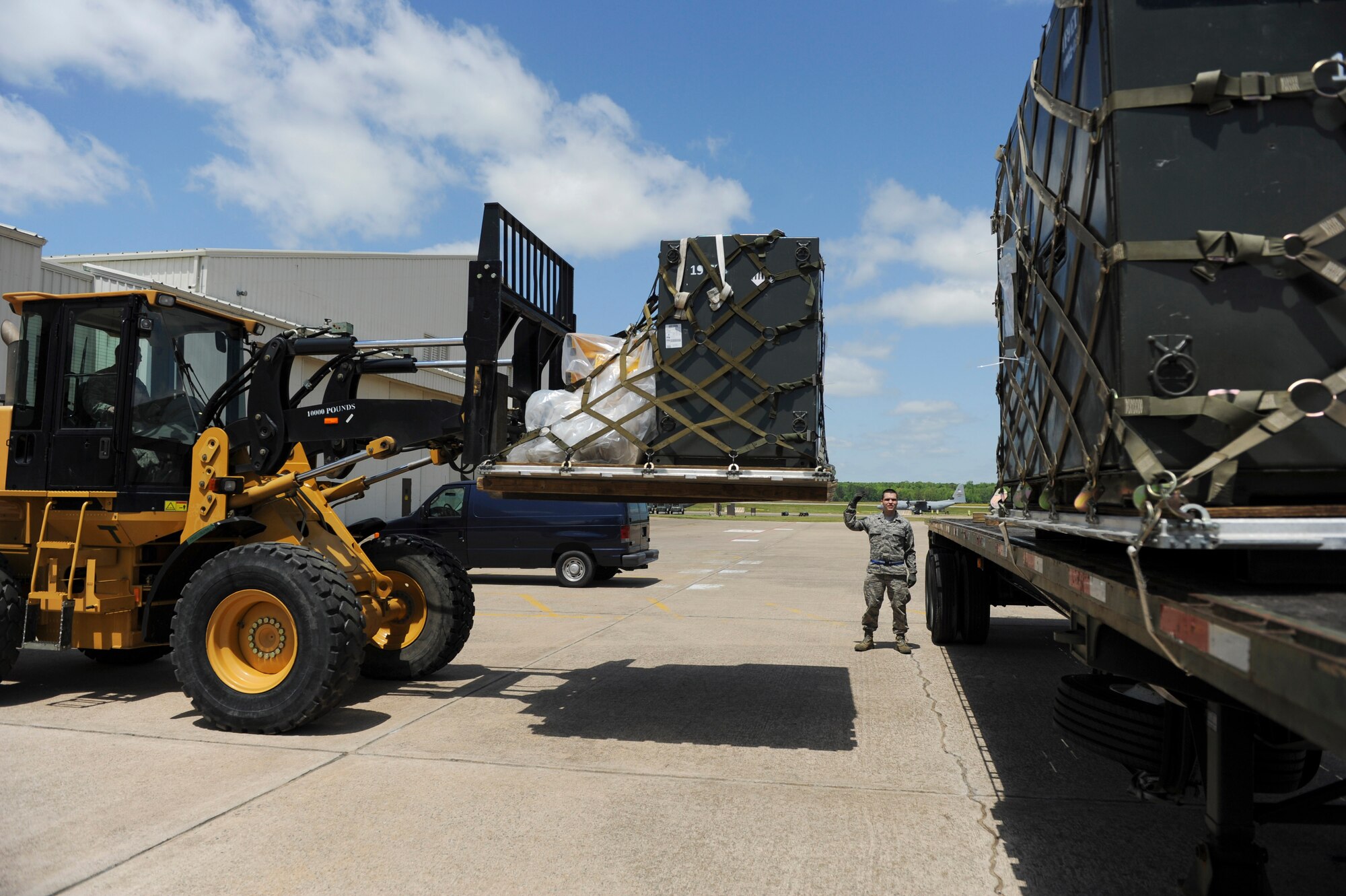 Members of the 19th Logistics Readiness Squadron load pallets on to a trailer during a Rockex exercise April 24, 2013, at Little Rock Air Force Base, Ark. The Rockex is an exercise held to simulate deployment scenarios. (U.S. Air Force photo by Senior Airman Rusty Frank)