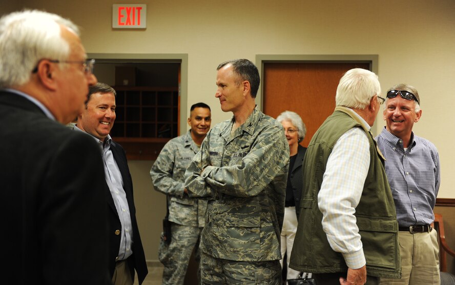 U.S. Air Force Col. Billy Thompson, 23d Wing commander, takes a minute to talk to the members of the South Regional Joint Development Authority (SRJDA) before signing a Transfer and Acceptance of DoD Real Property document April 22, 2013, at Moody Air Force Base, Ga. Moody acquired 24.56 acres of land adjacent to the installation’s northwest boundary. (U.S. Air Force photo by Staff Sgt. Melissa K. Mekpongsatorn/Released)
