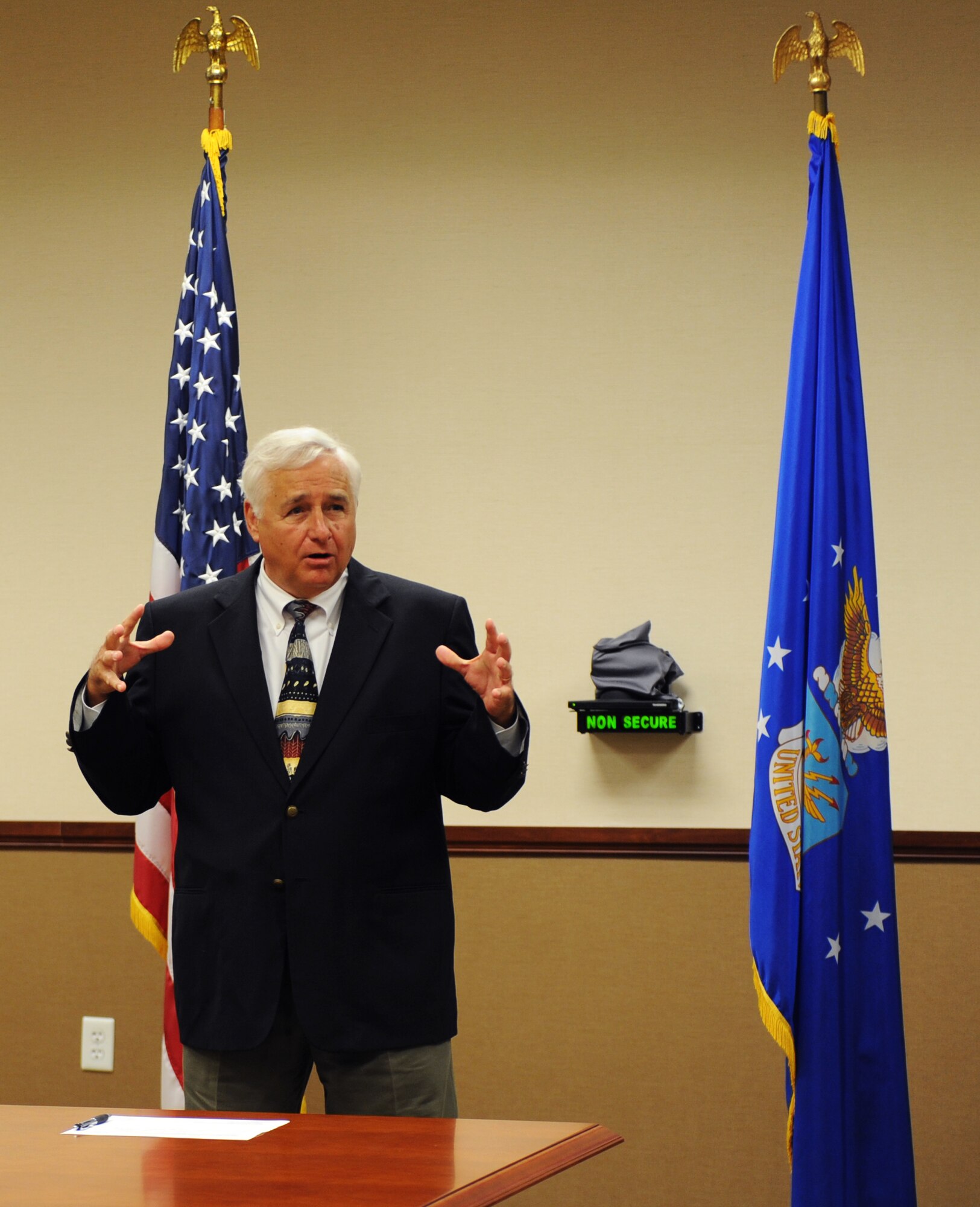 Glenn Gregory, South Regional Joint Development Authority (SRJDA) chairman, talks to members of the SRJDA and Moody wing leadership about the importance of working together prior to the signing of a Transfer and Acceptance of DoD Real Property document April 22, 2013, at Moody Air Force Base, Ga. After more than four years of work and with the support of the SRJDA, Moody acquired 24.56 acres of land. (U.S. Air Force photo by Staff Sgt. Melissa K. Mekpongsatorn/Released) 
