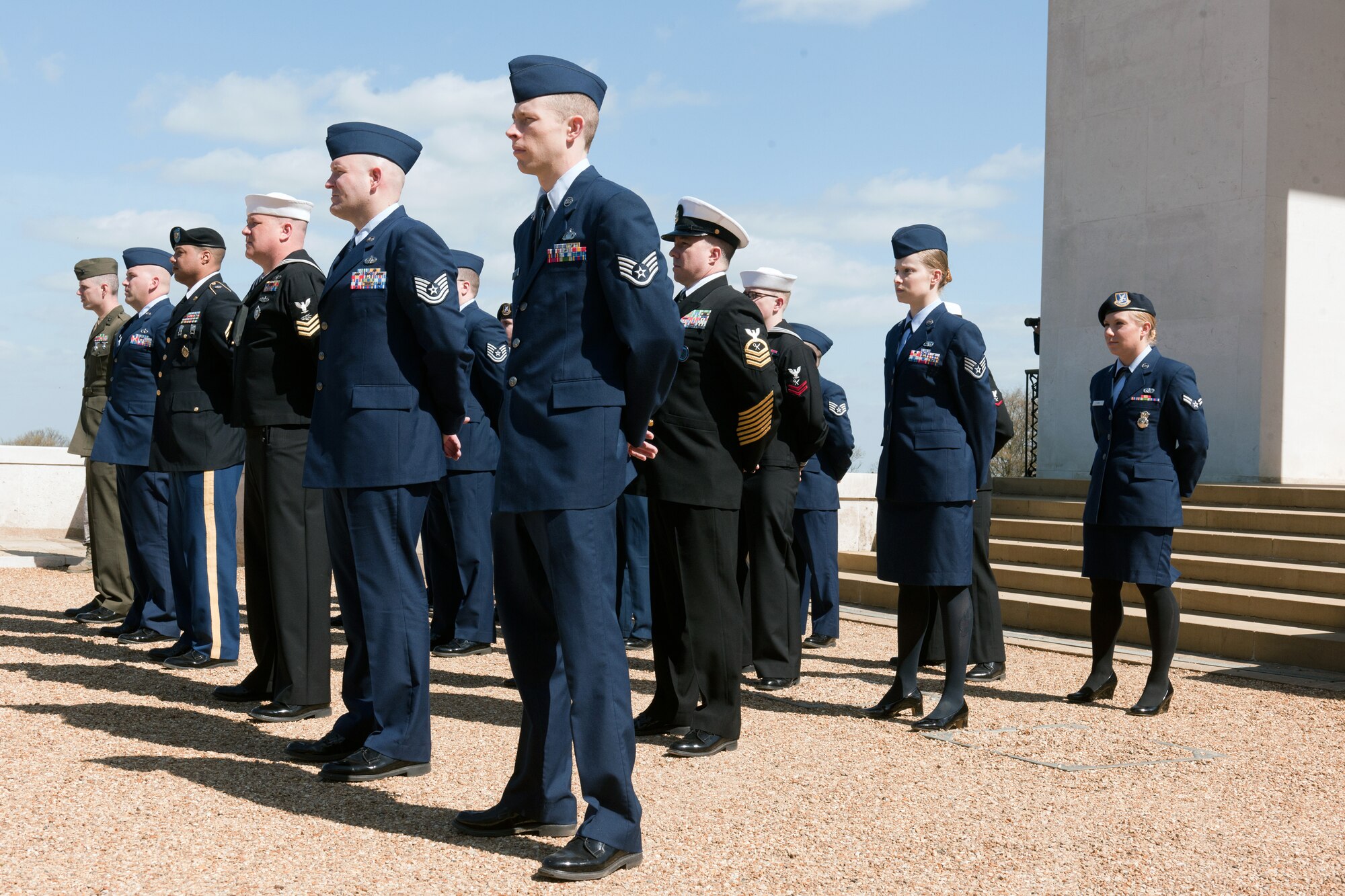 MADINGLEY, United Kingdom – Members of the 423rd Air Base Group and its mission partners stand in formation during a ceremony at Cambridge American Cemetery, in Madingley, United Kingdom, commemorating the 69th anniversary of the Exercise Tiger tragedy April 23. In all 749 American Soldiers and Sailors died April 27, 1944, during one of several assault rehearsals in exercise Tiger conducted at Slapton Sands on the Devon coast of England in preparation for the launch of Operation Overlord. (U.S. Air Force photo by Staff Sgt. Brian Stives)