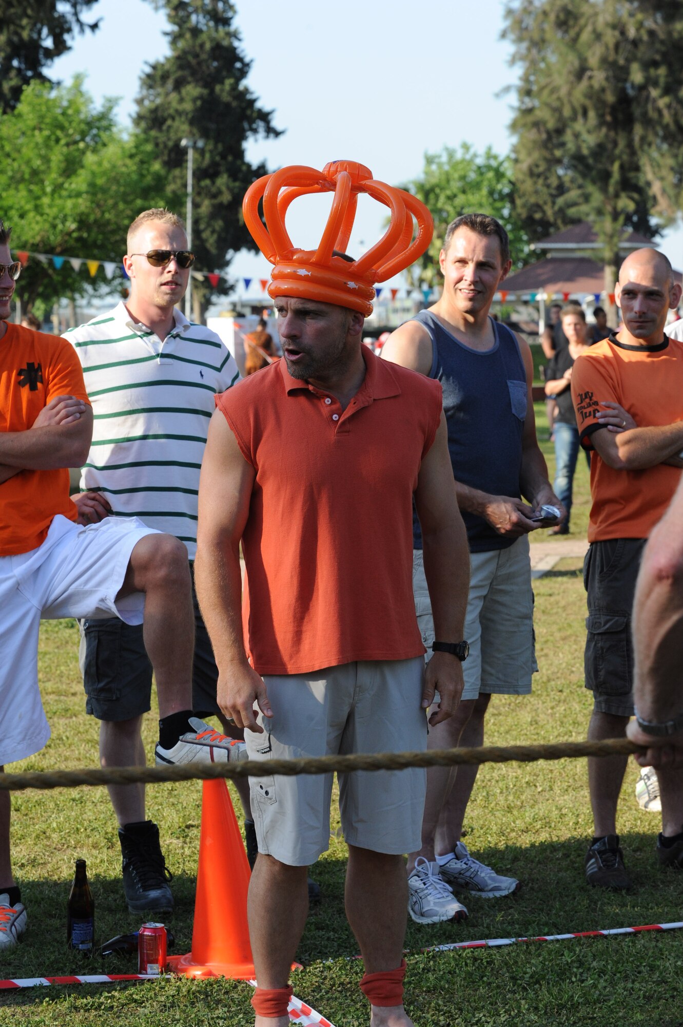 A Dutch soldier deployed to Incirlik Air Base in support of a NATO-led operation to boost Turkey’s air defense capabilities by providing Patriot missile batteries referees a touwtrekken toernooi (tug-of-war tournament) during a Koninginnedag, or Queen’s Day, celebration held at Arkadas Park April 25, 2013, Incirlik Air Base Turkey. Many attendees wore orange, the color of the Dutch royal family which traces its history back to William of Orange. (U.S. Air Force photo by 1st Lt. David Liapis/Released)