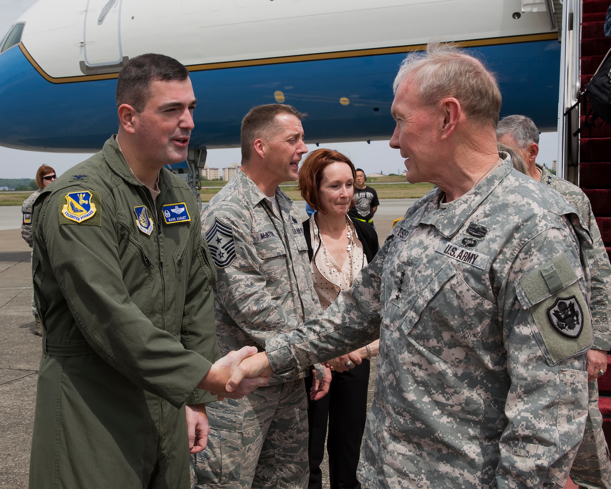 YOKOTA AIR BASE, Japan -- Air Force Col. Mark R. August, 374th Airlift Wing commander, greets Army Gen. Martin Dempsey, chairman of the Joint Chiefs of Staff, upon his arrival at Yokota Air Base, Japan, April 25, 2013. Dempsey traveled to South Korea, China and Japan during his tour of the Pacific region. (U.S. Air Force photo by Osakabe Yasuo) 