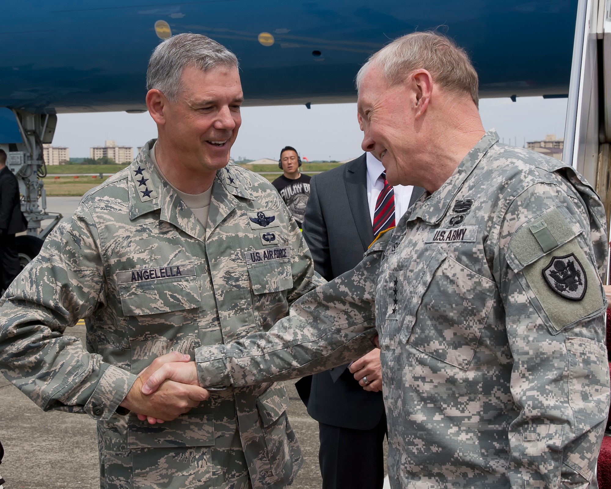YOKOTA AIR BASE, Japan -- Air Force Lt. Gen. Sam Angelella, U.S. Forces, Japan and 5th Air Force commander, greets Army Gen. Martin E. Dempsey, chairman of the Joint Chiefs of Staff, upon his arrival at Yokota Air Base, Japan, April 25, 2013. Dempsey traveled to South Korea, China and Japan during his tour of the Pacific region. (U.S. Air Force photo by Osakabe Yasuo)