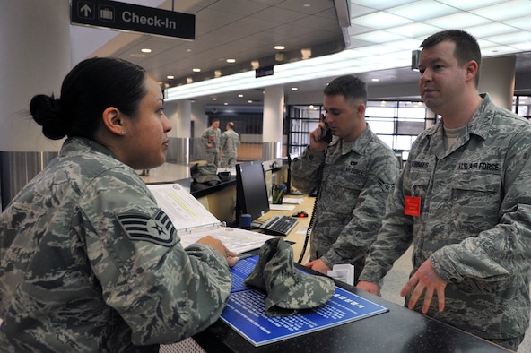 Staff Sgt. Jessicca Montague, 51st Logistics Readiness Squadron distribution vehicle operator, speaks with Staff Sgt. Nathan Ronimous, 731st Air Mobility Squadron passenger service supervisor, about Space-Available travel at the Osan passenger terminal on Osan Air Base, Republic of Korea, April 23, 2013. Space-A is travel authorized by the Department of Defense for passengers to occupy the surplus of seats after all space-required passengers and cargo have been accommodated. (U.S. Air Force photo/Senior Airman Alexis Siekert)