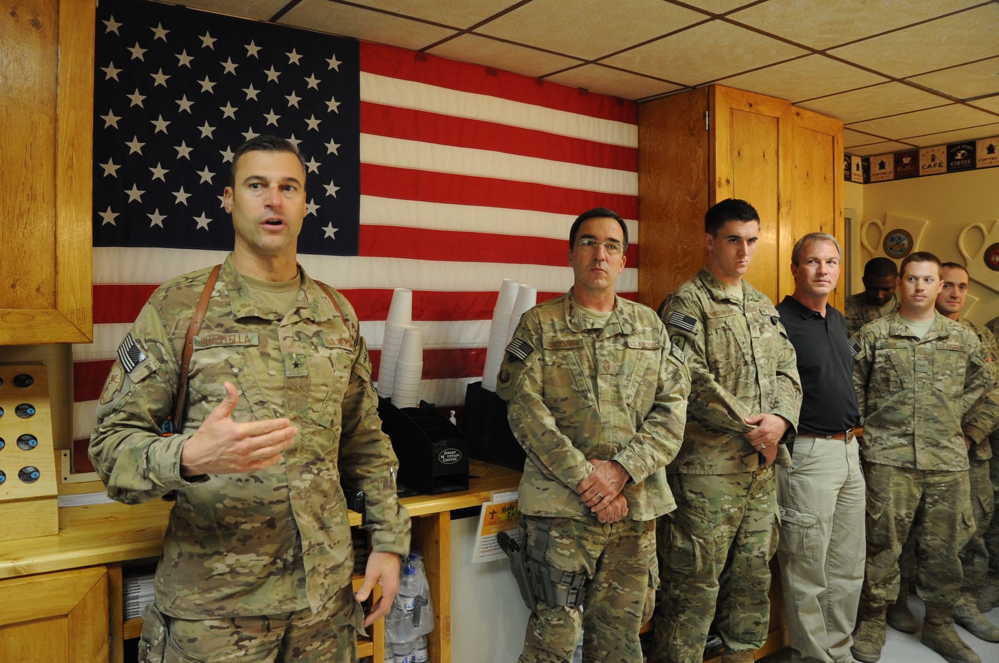 Brig. Gen. Joseph T. Guastella Jr., 455th Air Expeditionary Wing commander, speaks at the formal dedication of the new "Holy Joe's" cafe in the Craig Joint Theater Hospital on Bagram Airfield, Afghanistan, April 24, 2013. The cafe was created from almost totally from scratch by members of the 455th AEW chapel team and 455th Expeditionary Medical Group. (U.S. Air Force photo by Staff Sgt. David Dobrydney)